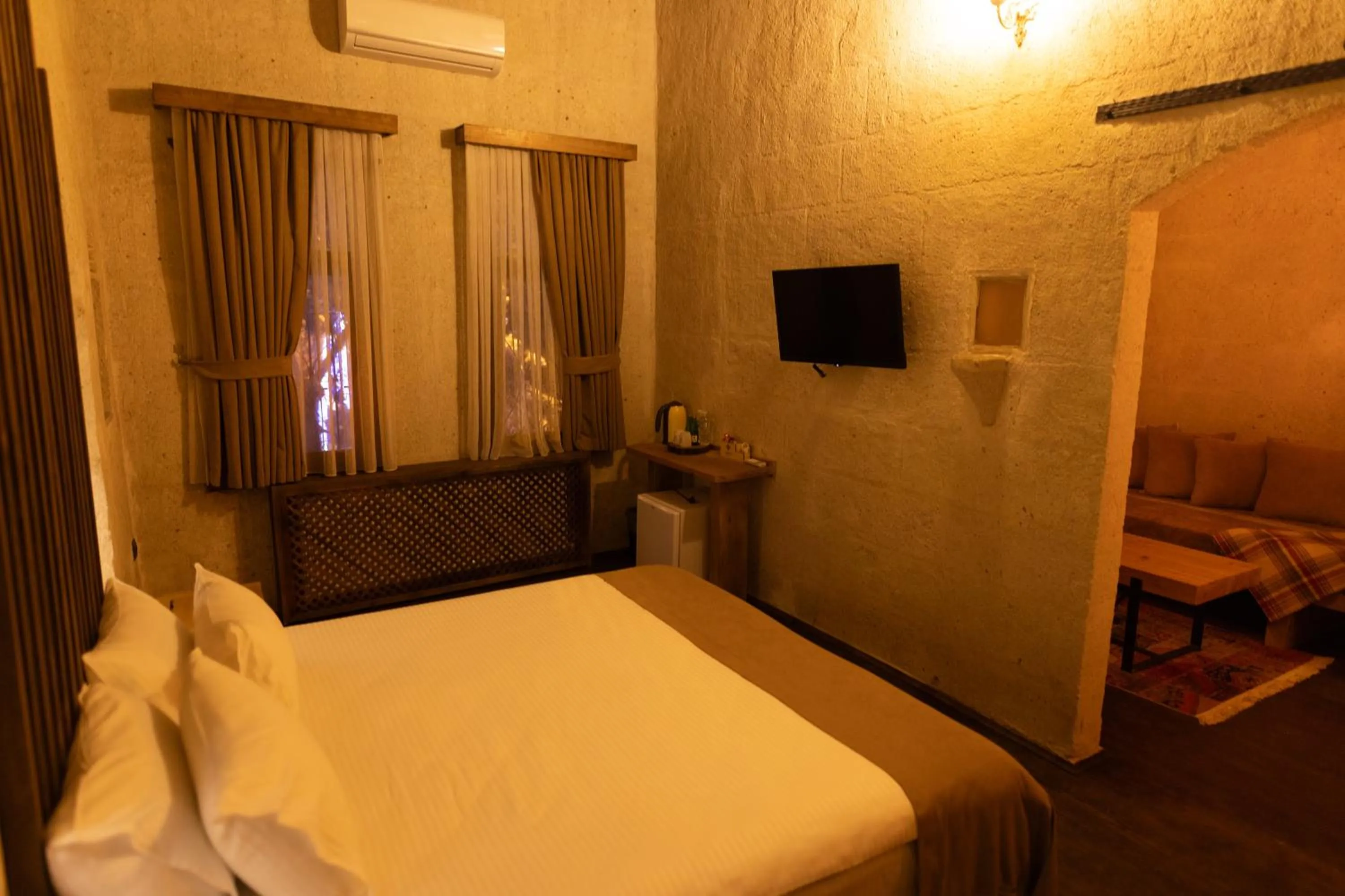 Bed in Lemon Cave Suites