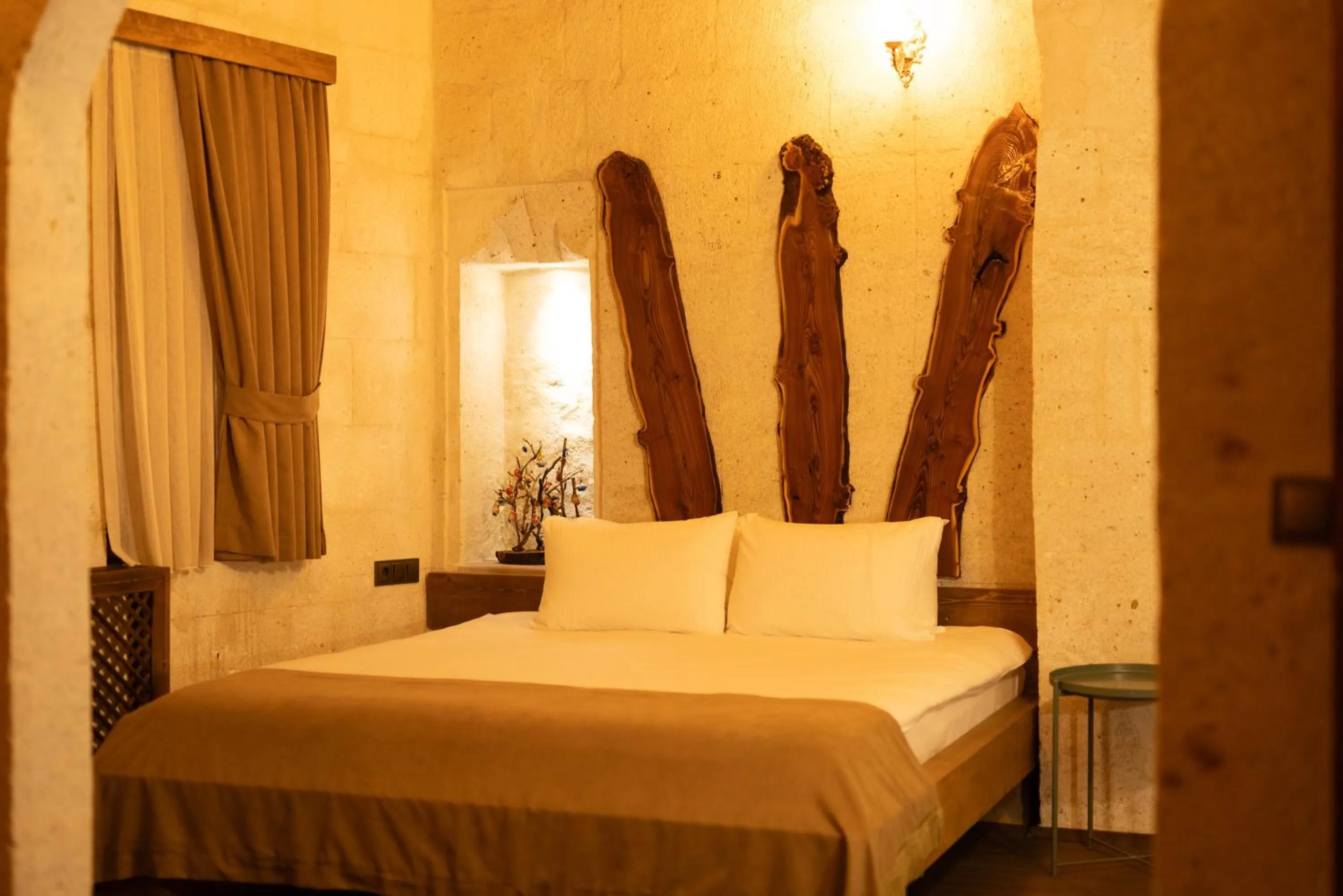 Bed in Lemon Cave Suites