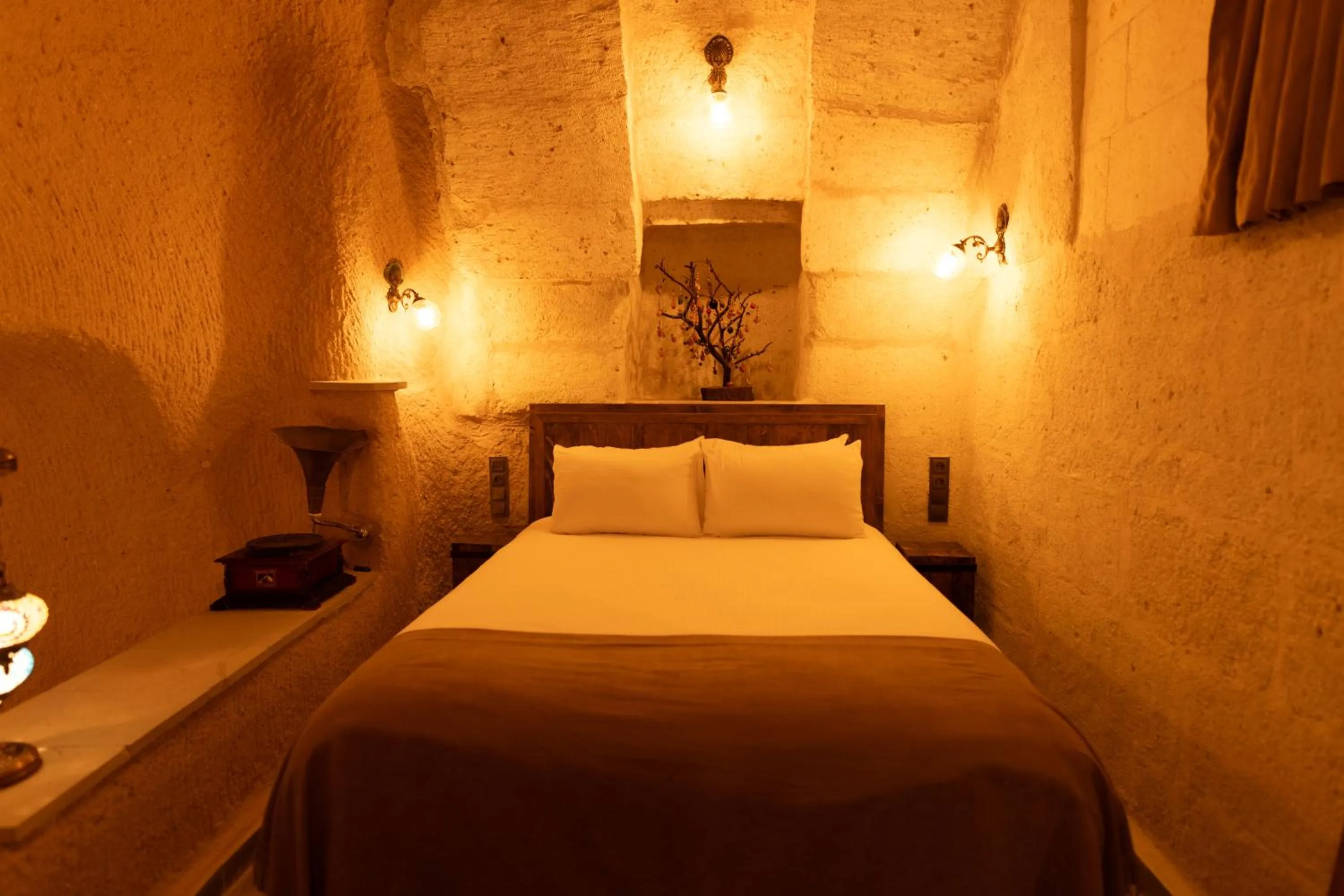 Bed in Lemon Cave Suites