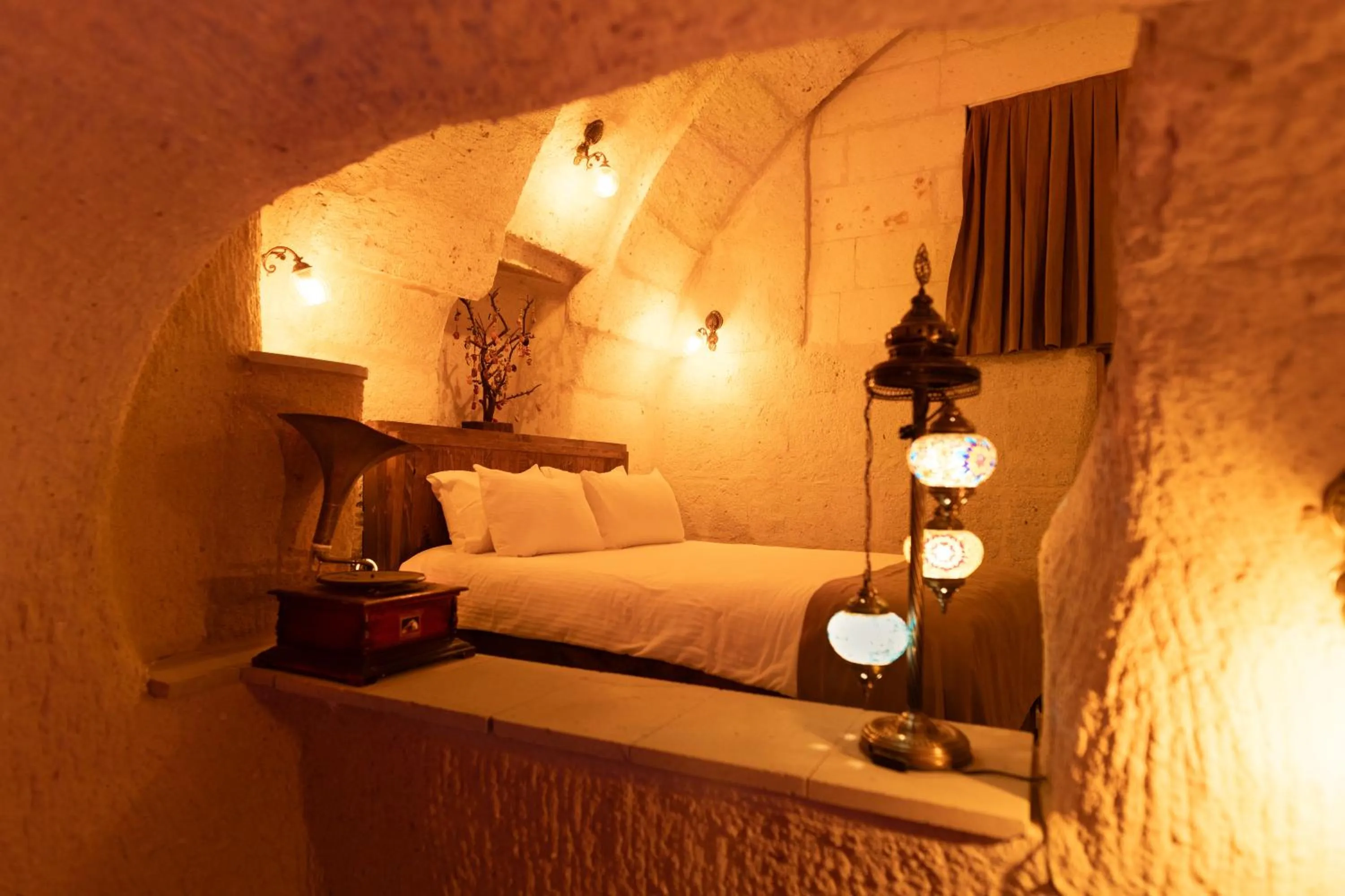Bed in Lemon Cave Suites