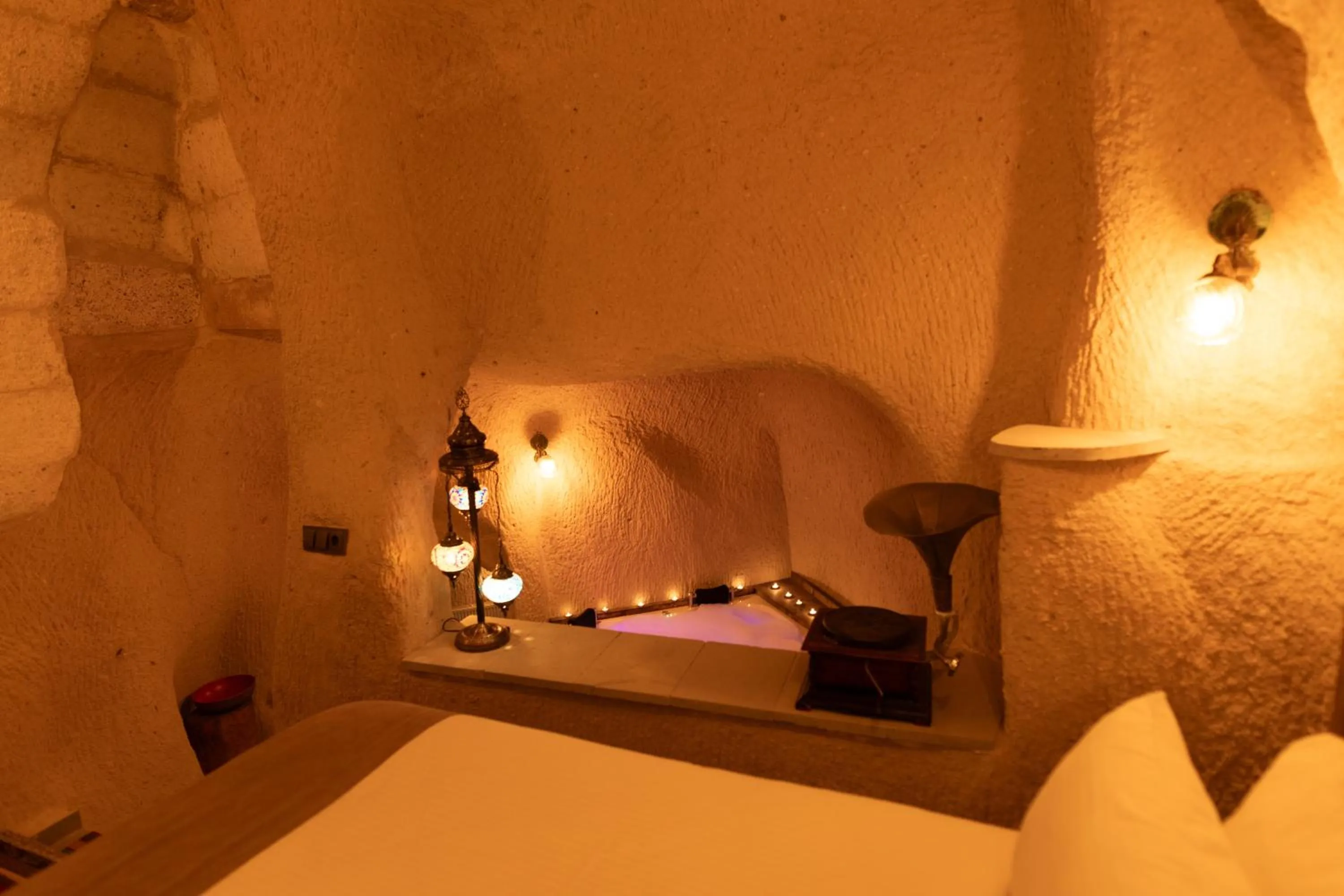 Bed in Lemon Cave Suites