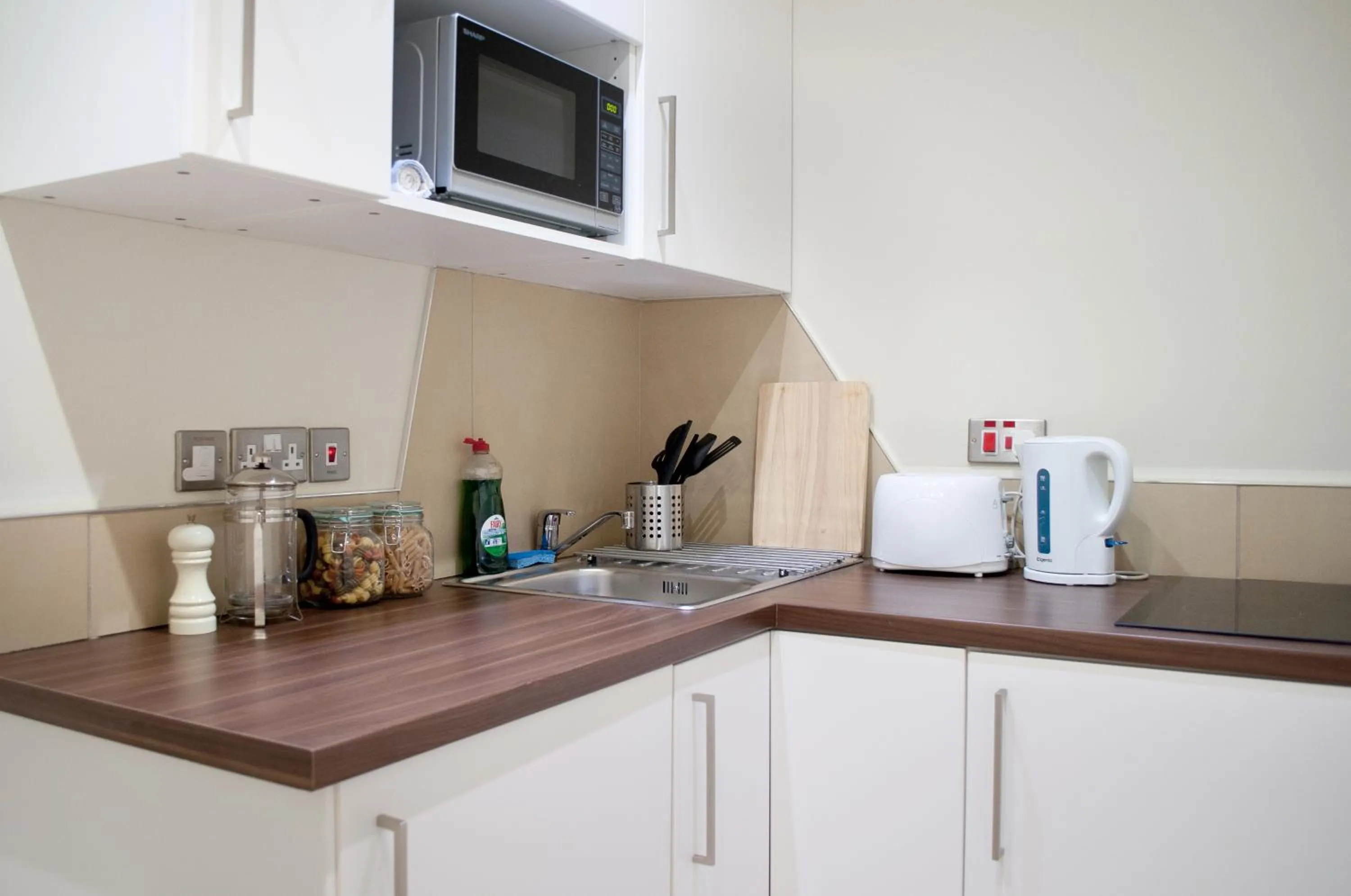 Kitchen or kitchenette in Palmerston Suites
