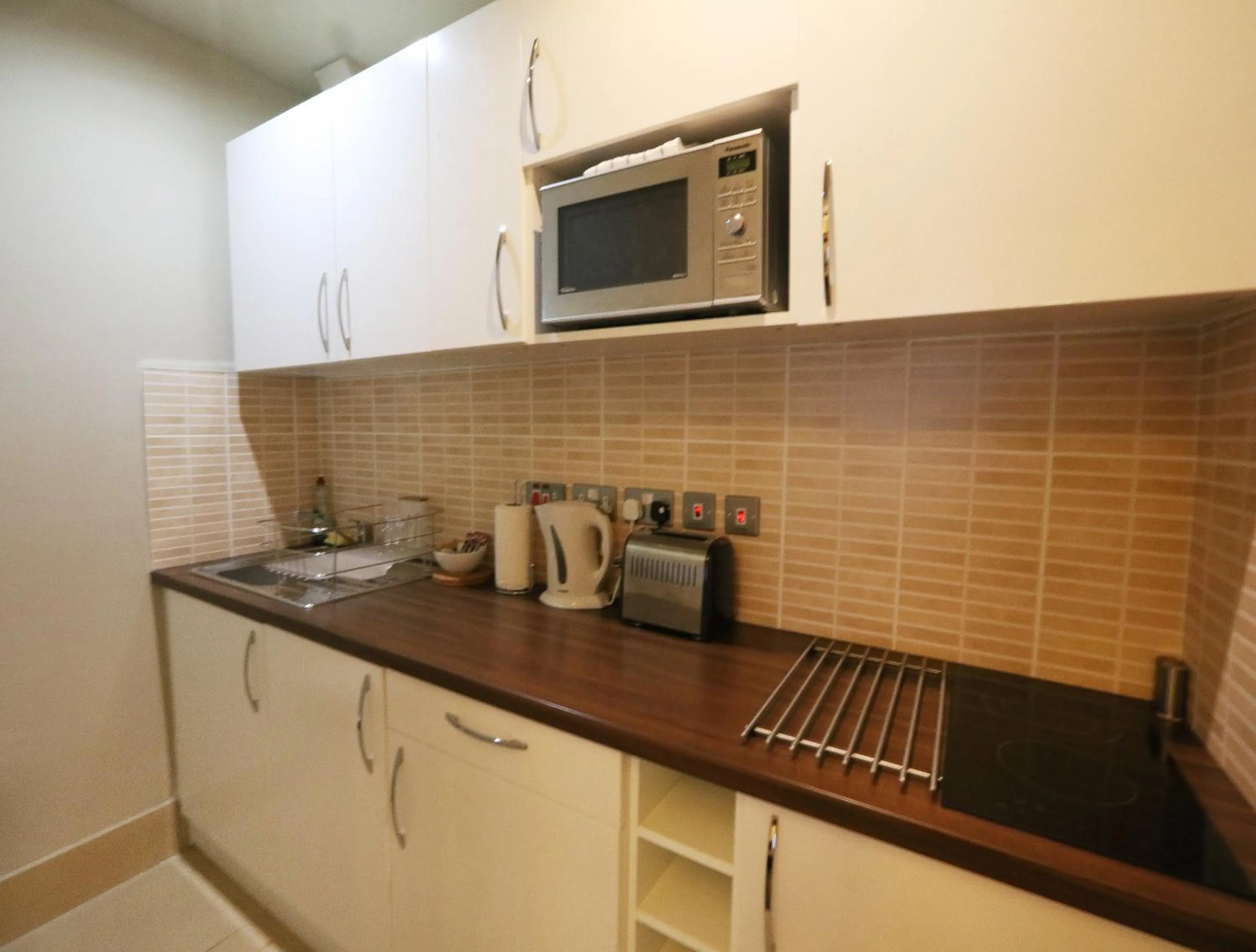 Kitchen or kitchenette in Palmerston Suites