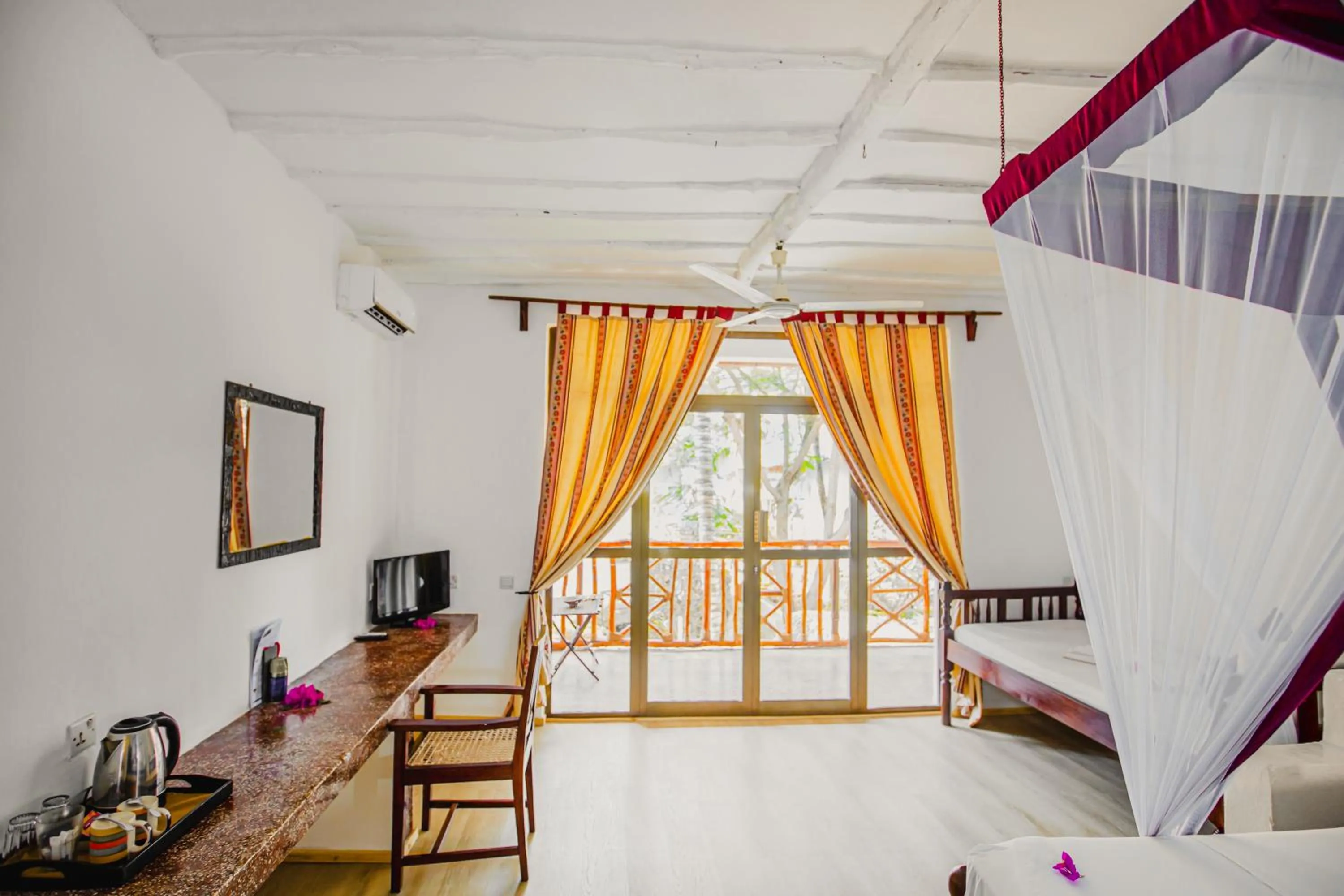 Photo of the whole room, Bed in AHG Waridi Beach Resort & SPA