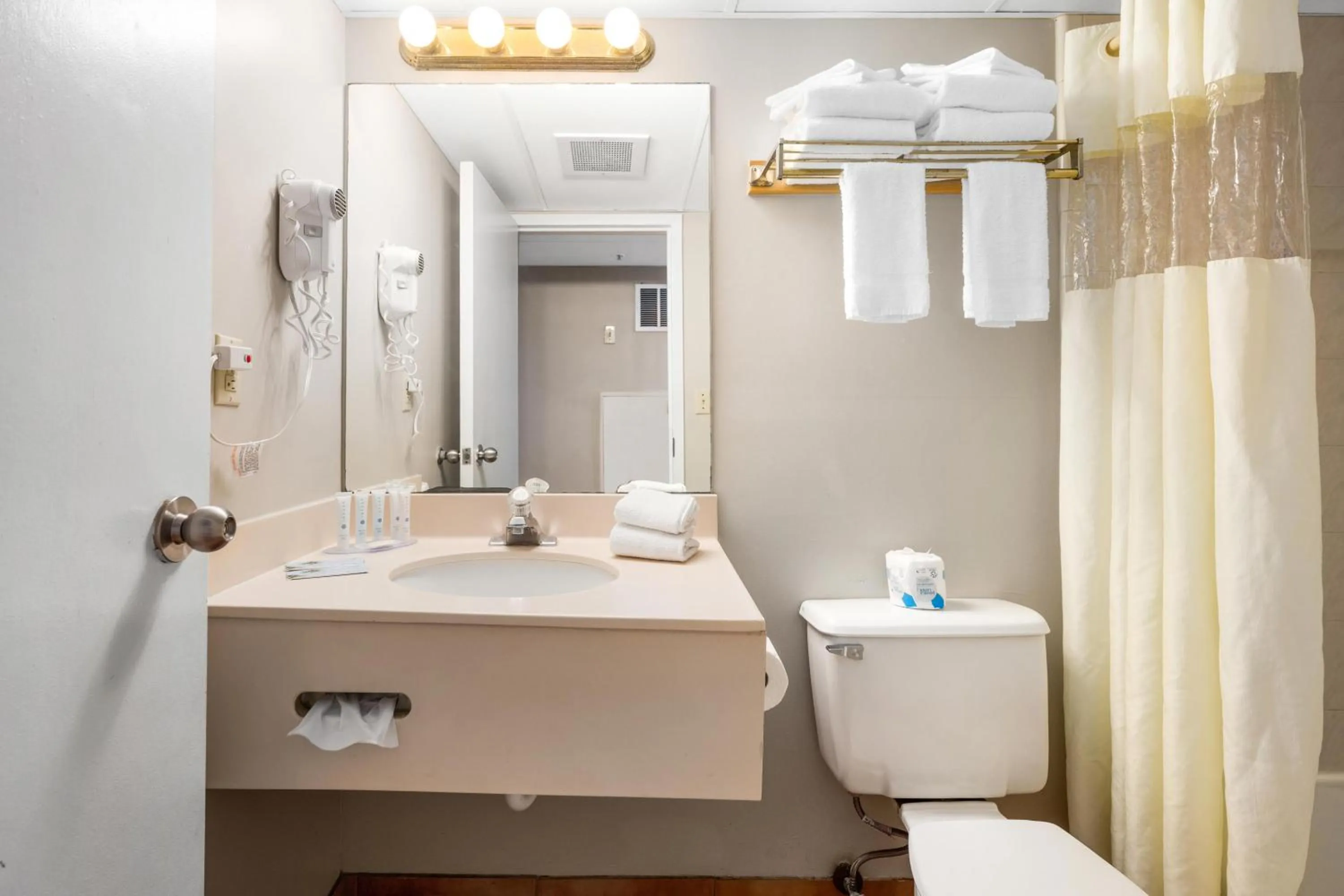 Toilet in Tidelands Caribbean Boardwalk Hotel and Suites