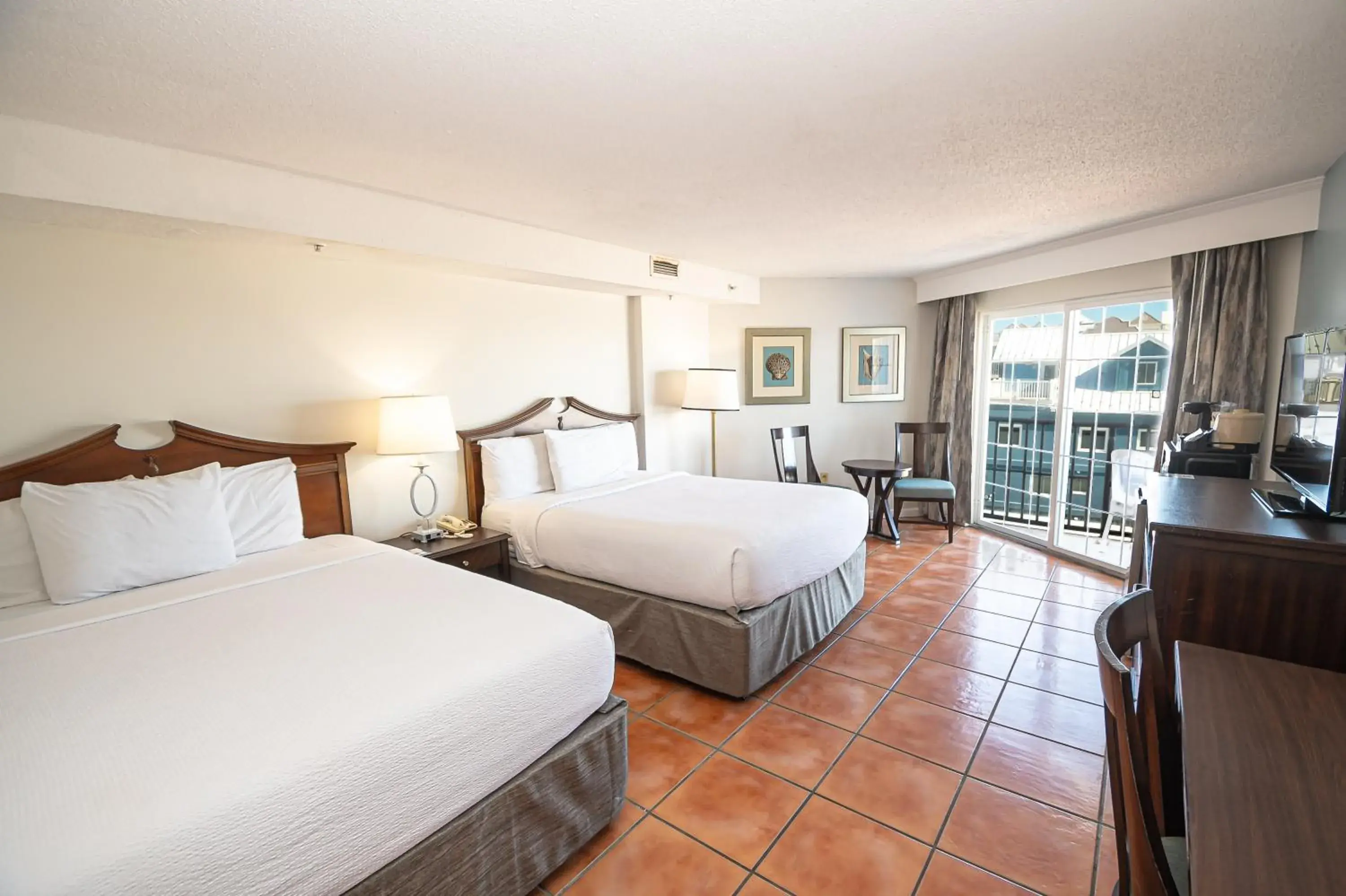 Queen Room with Two Queen Beds - Partial Ocean View in Tidelands Caribbean Boardwalk Hotel and Suites Queen Room with Two Queen Beds - Partial Ocean View in Tidelands Caribbean Boardwalk Hotel and Suites