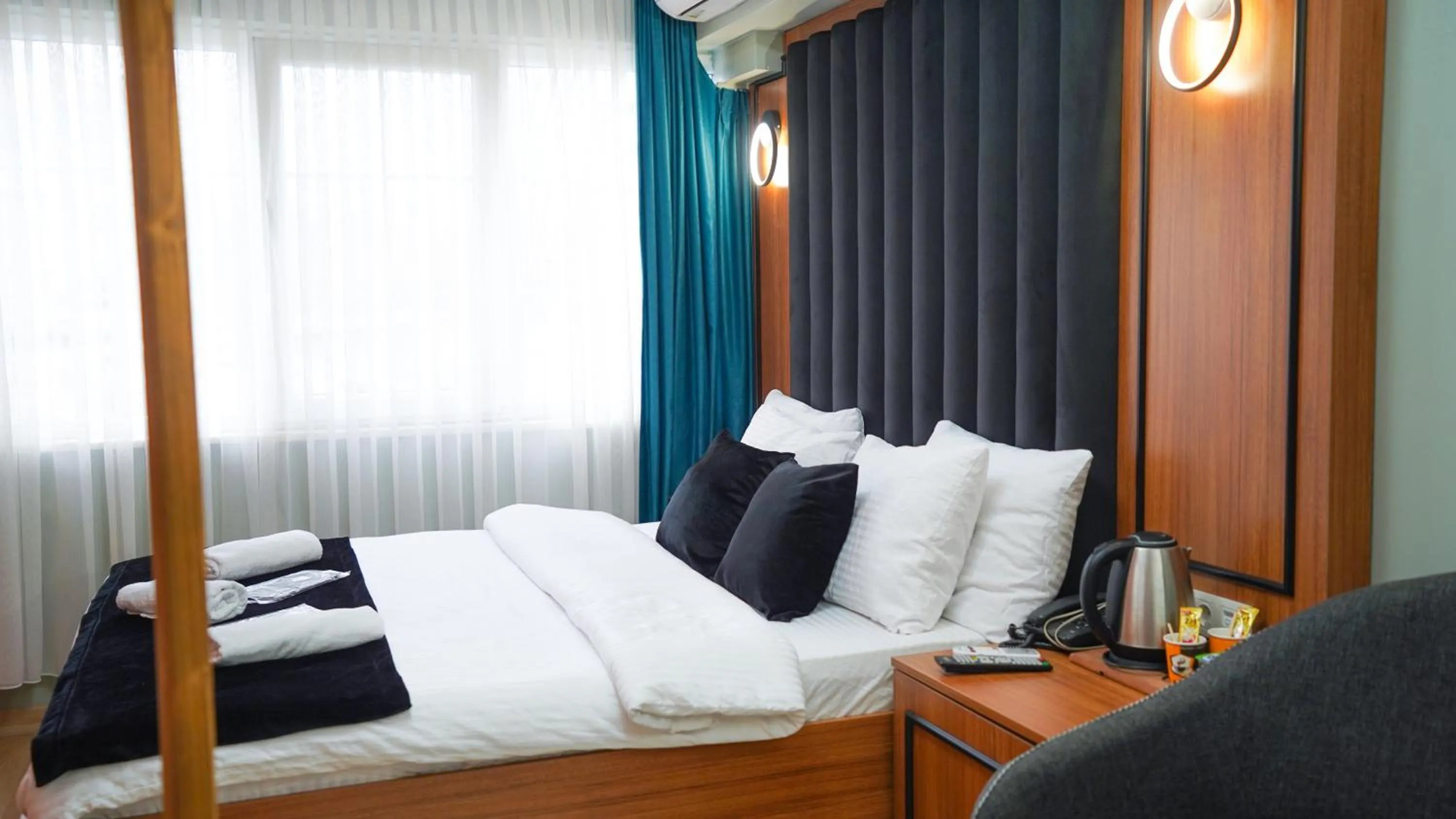 Bed in Luka Suit Hotel