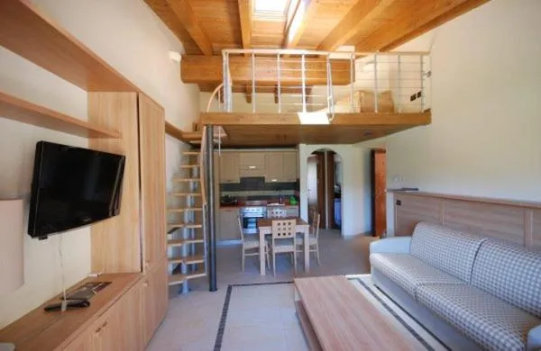 Communal lounge/ TV room in Tassido Coda Resort