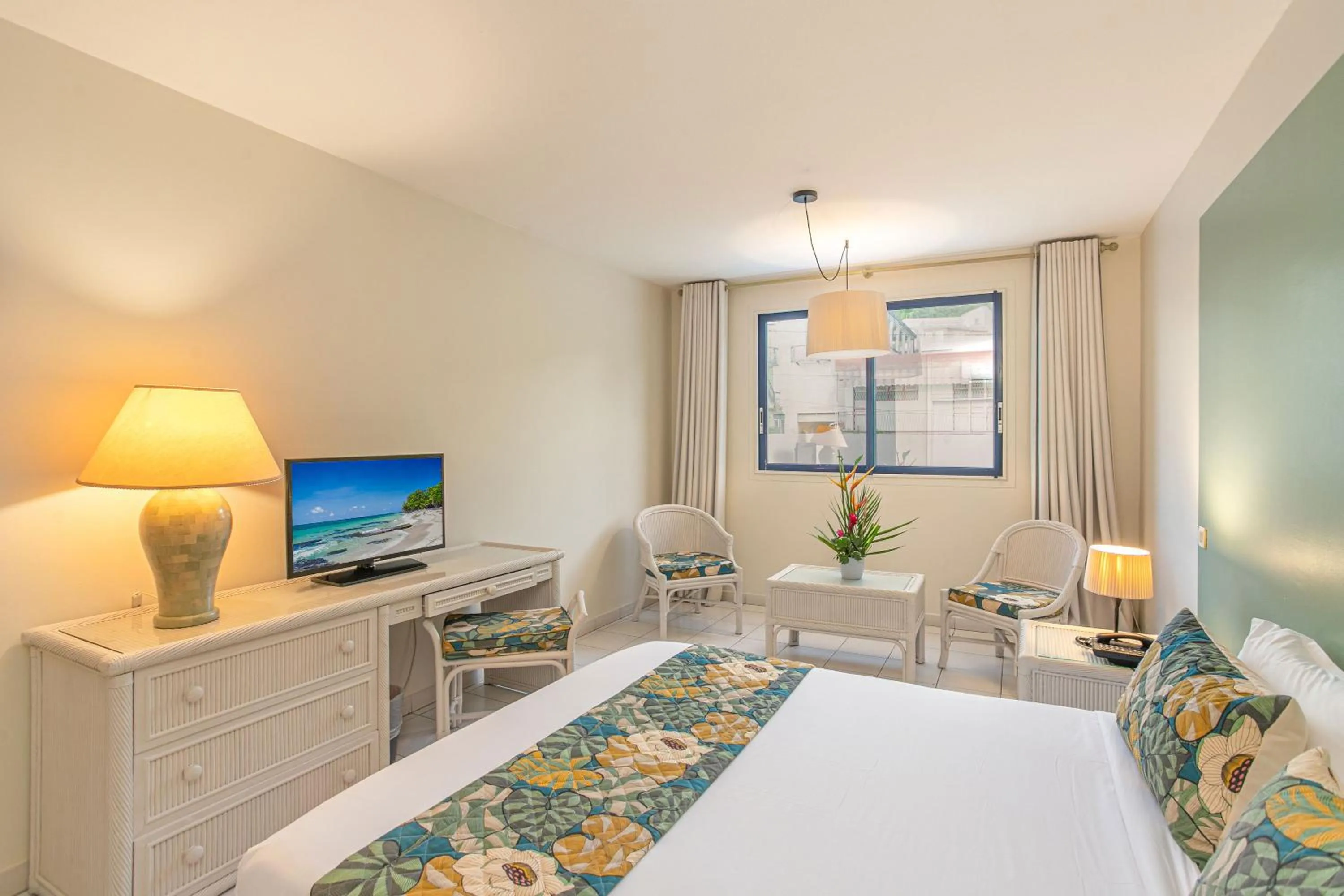 Bed in Karibea Squash Hôtel