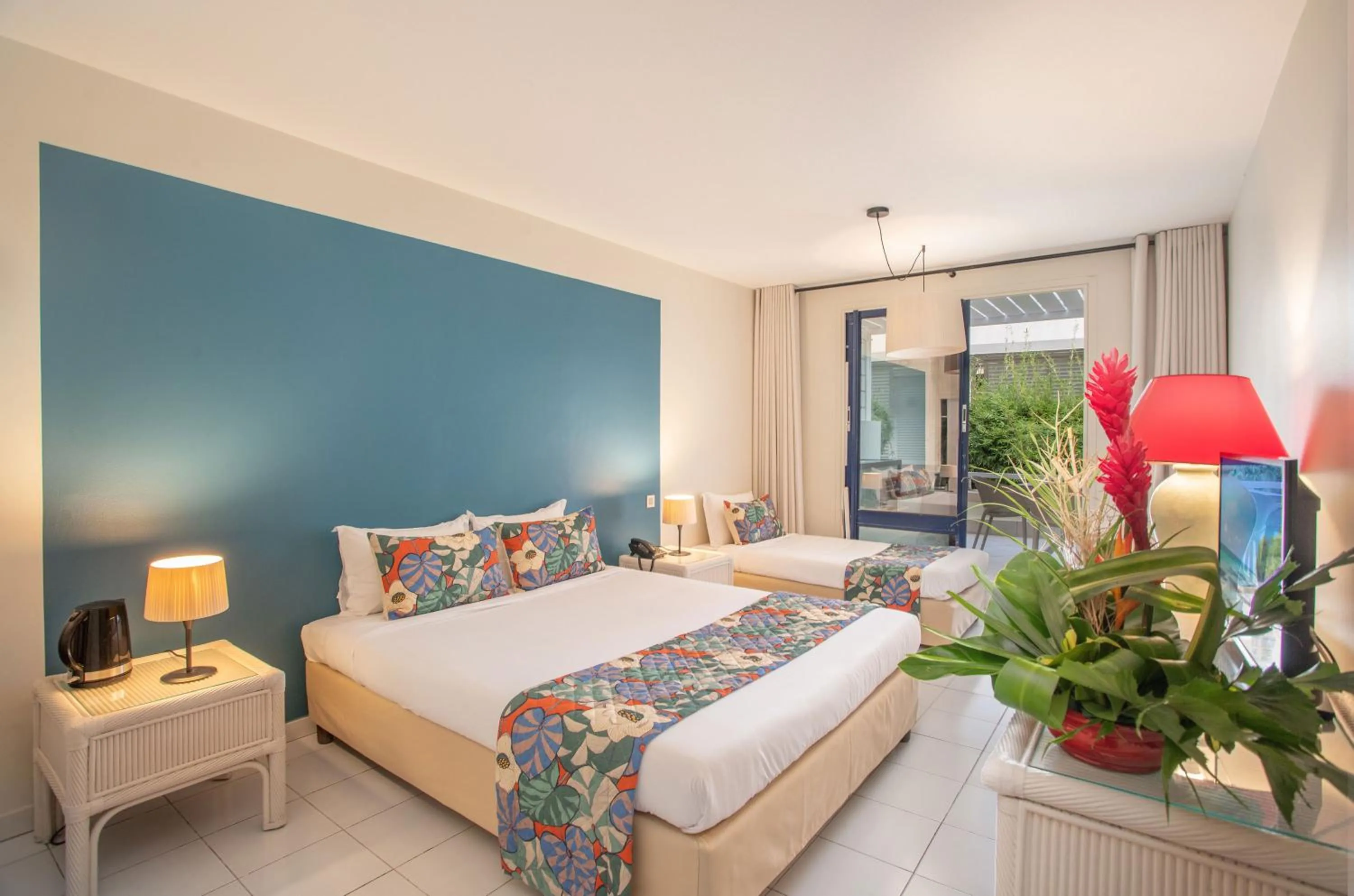 Bed in Karibea Squash Hôtel