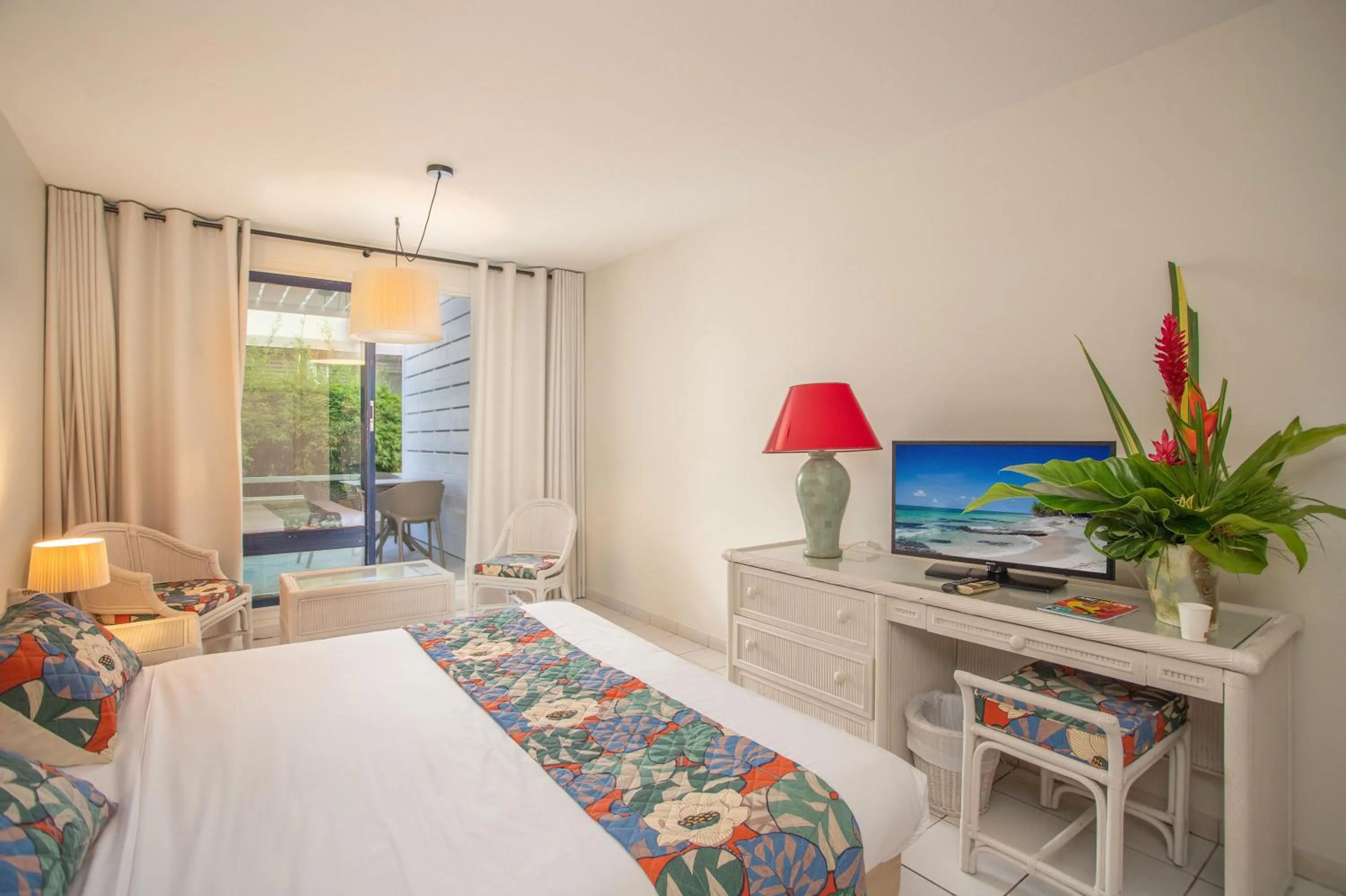 Bed in Karibea Squash Hôtel