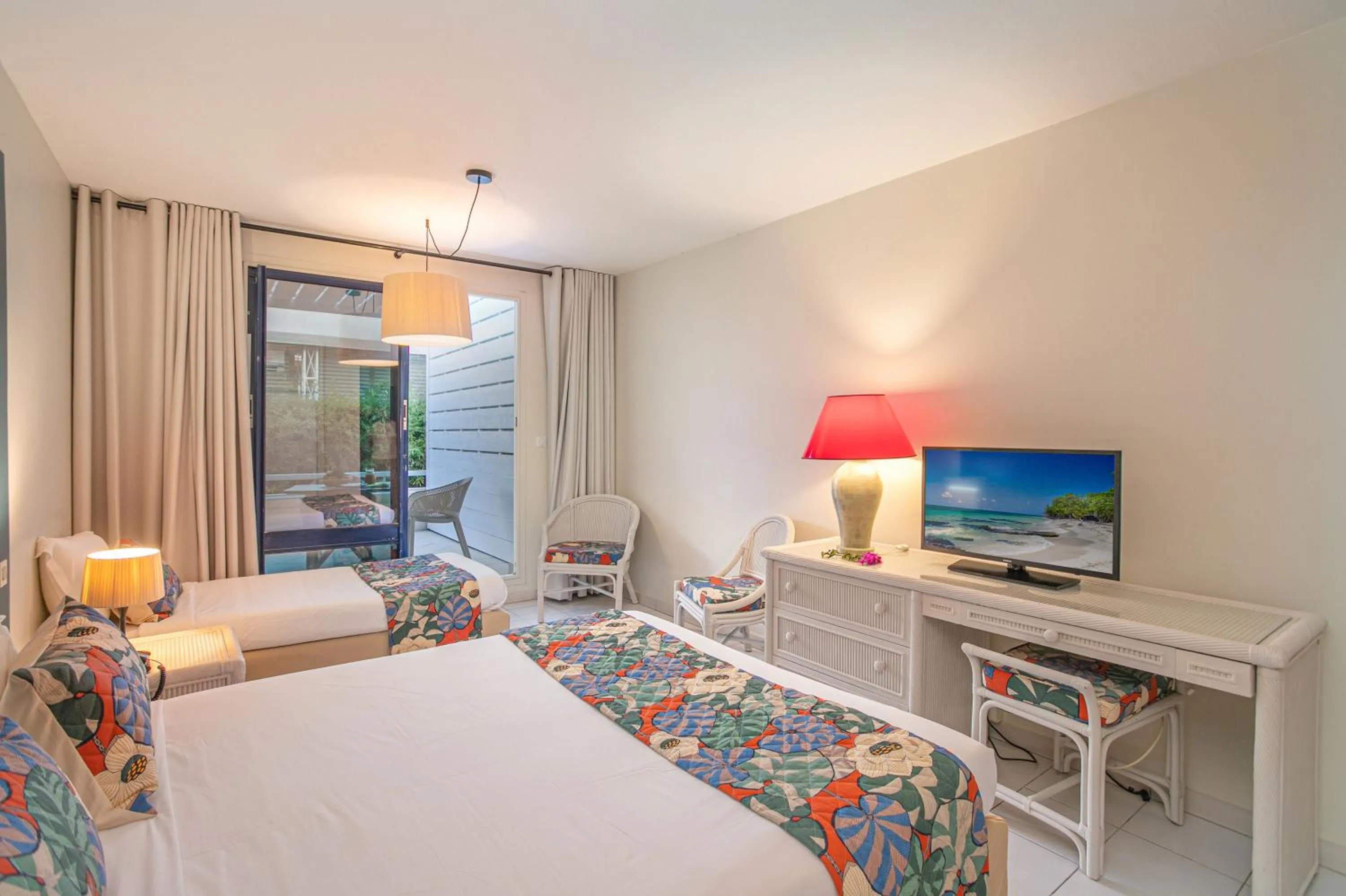 Bed in Karibea Squash Hôtel