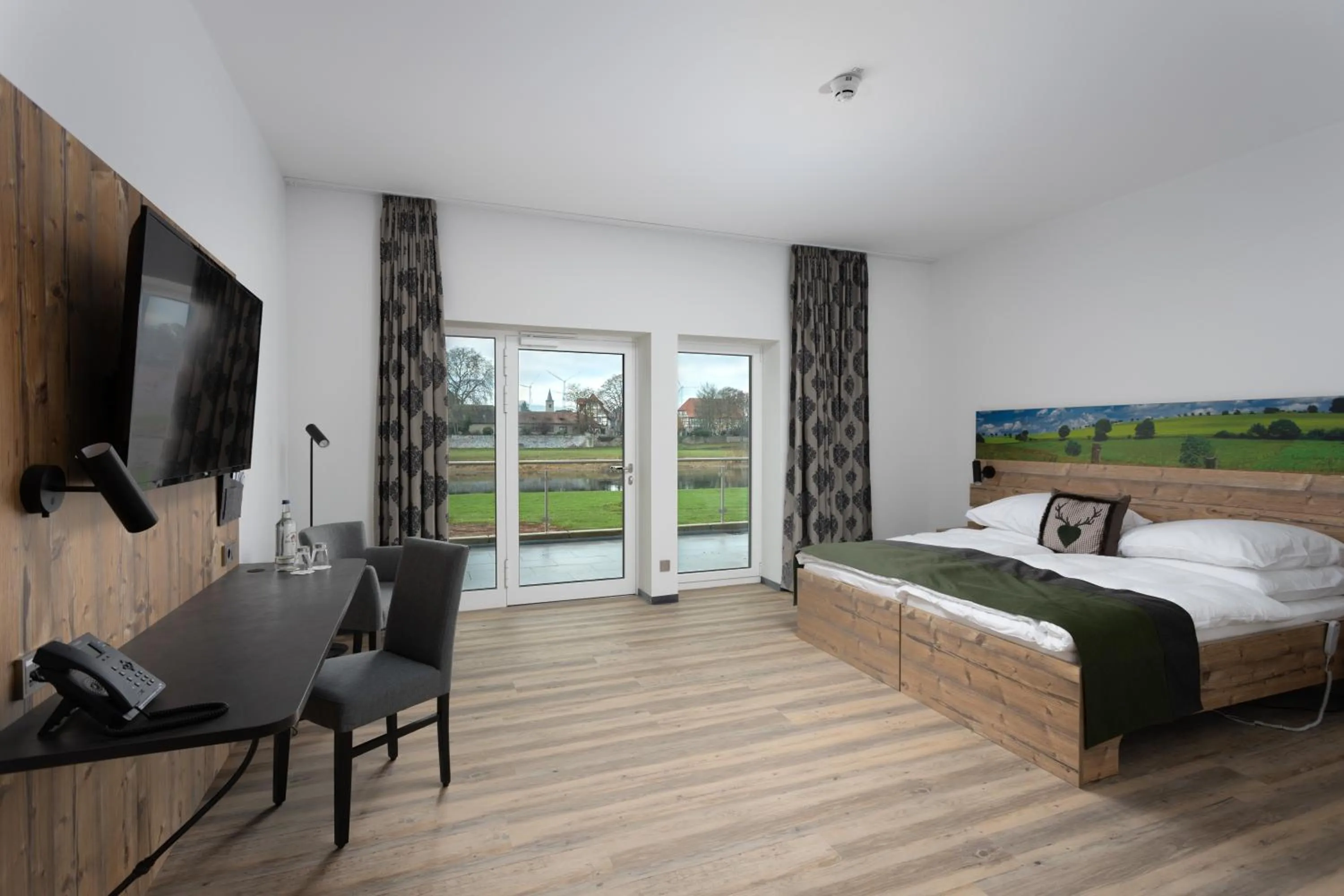 Photo of the whole room, Bed in Hotel Grohnder Fährhaus