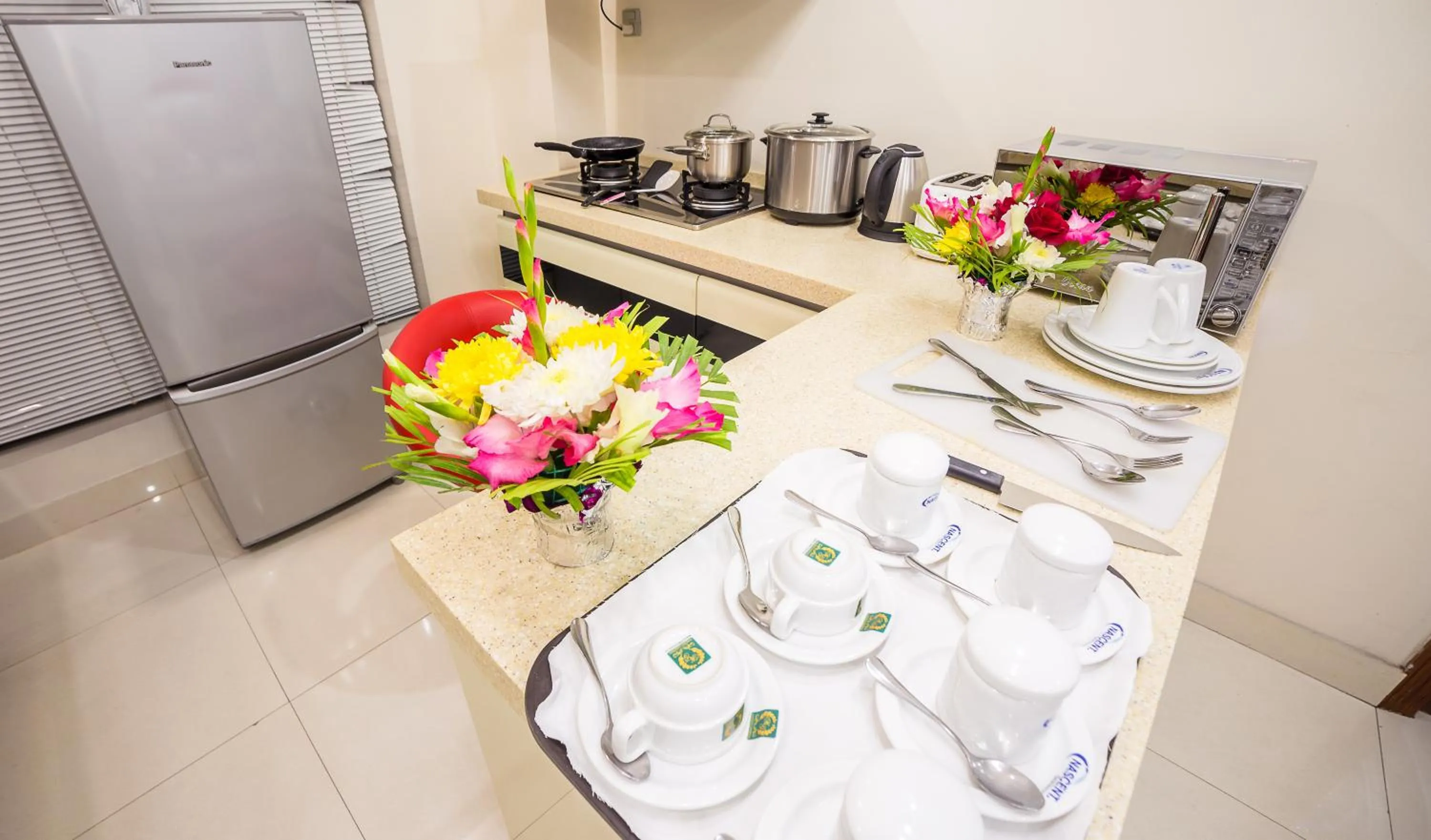 Kitchen or kitchenette in Nascent Gardenia Luxury Suites