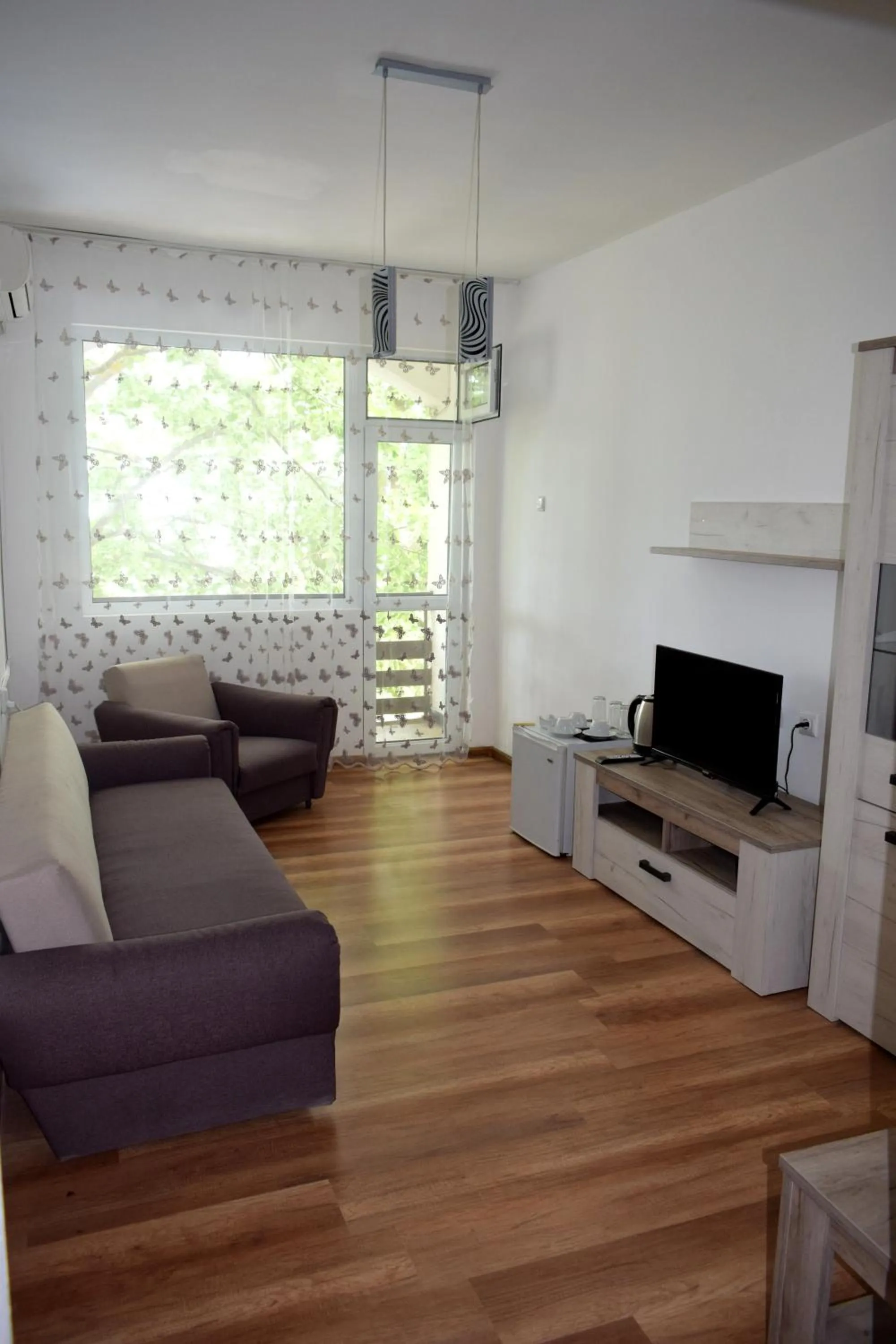 Seating area in Ahilea Hotel - Free Pool Access