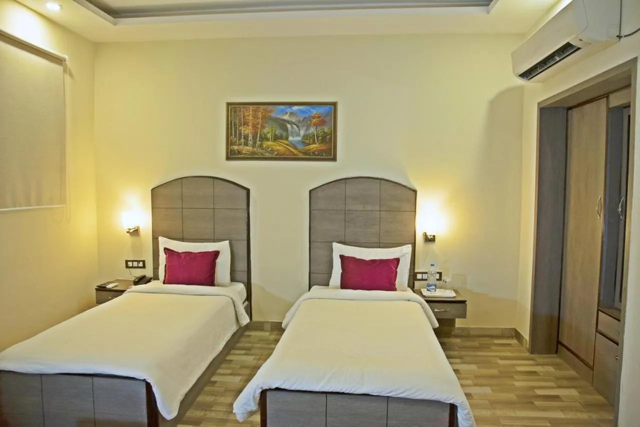 Bed in Spring Sky Mughalsarai By ShriGo Hotels