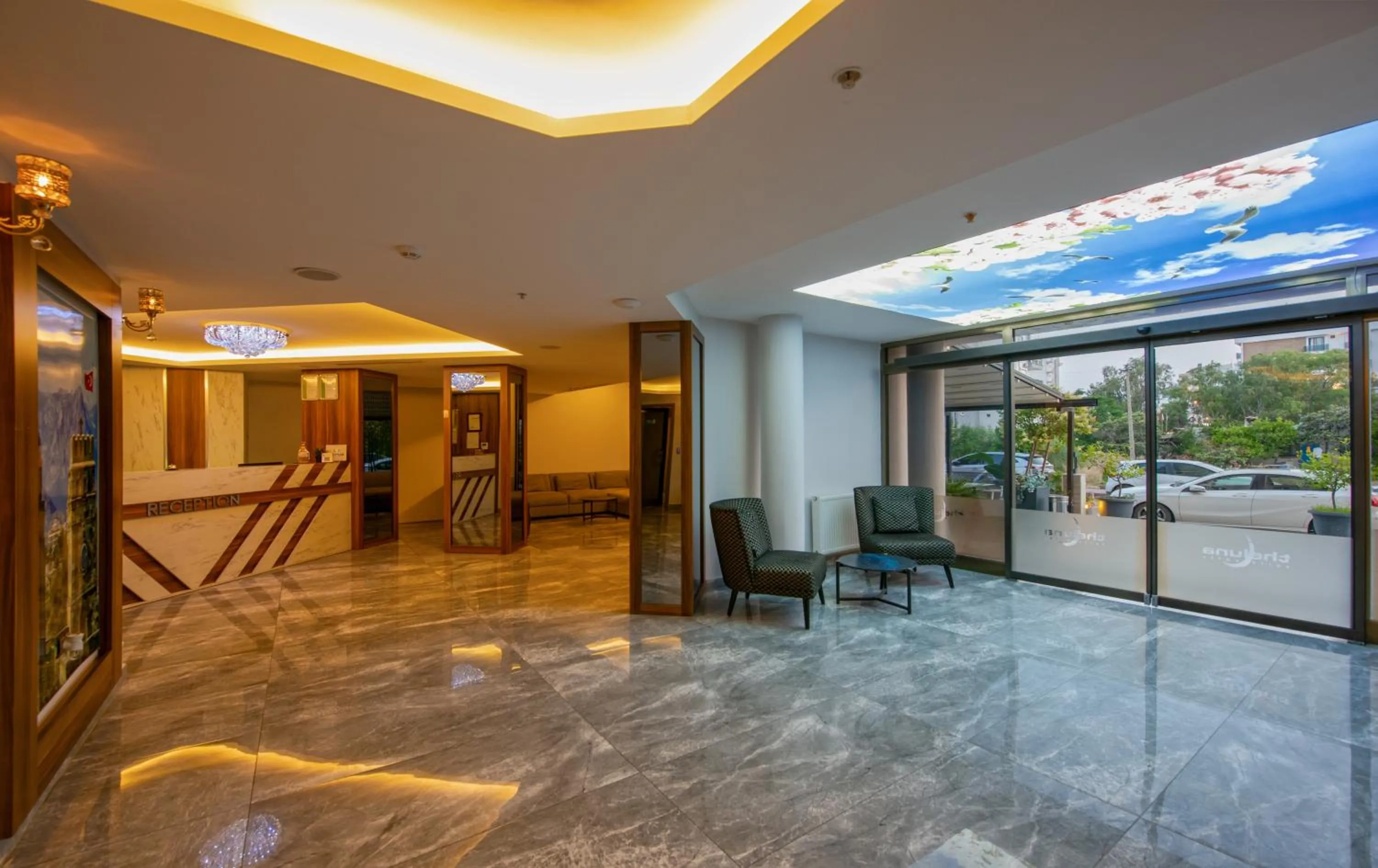 Lobby or reception in Citrus Luna Suite Hotel