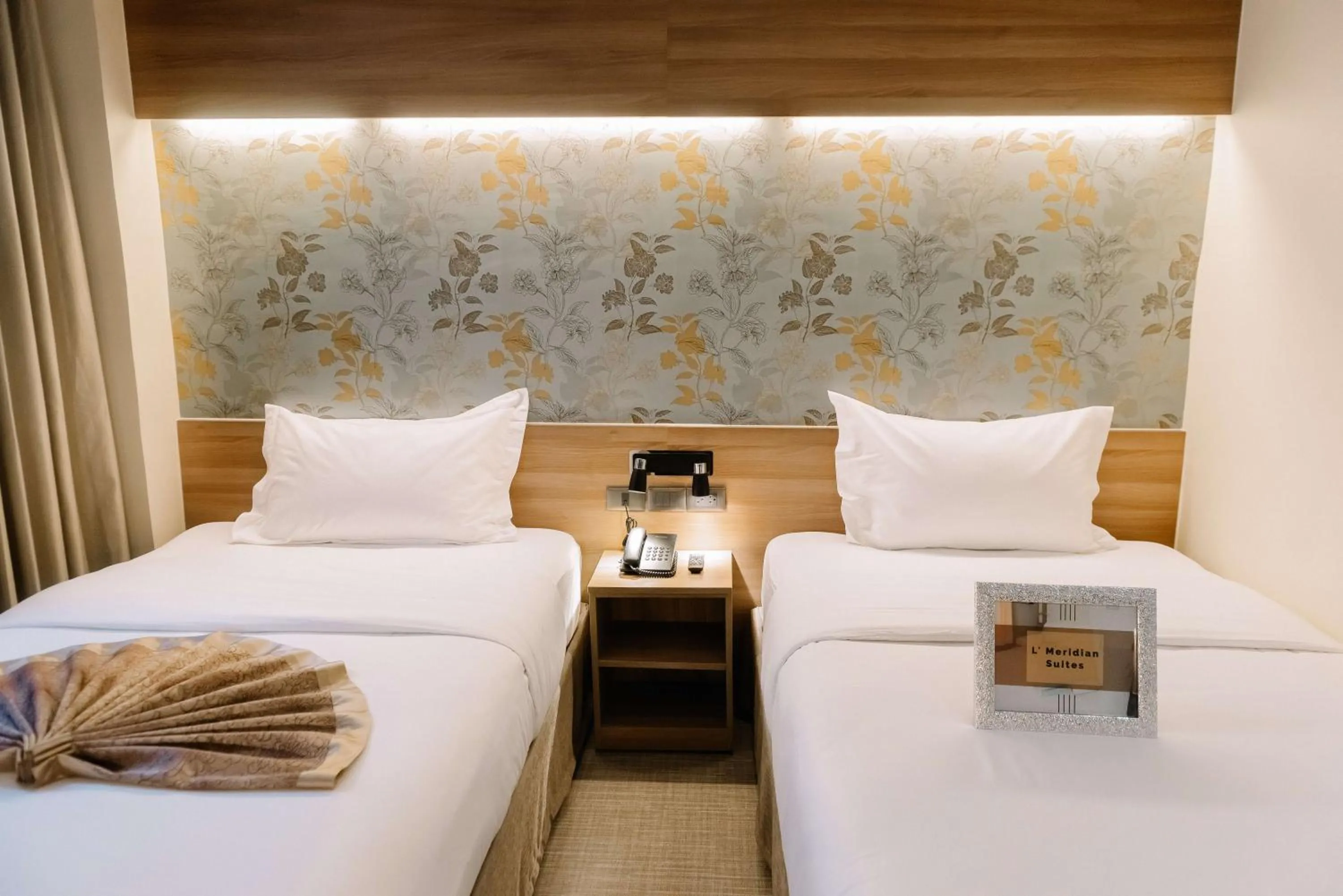 Bed in L' Meridian Suites