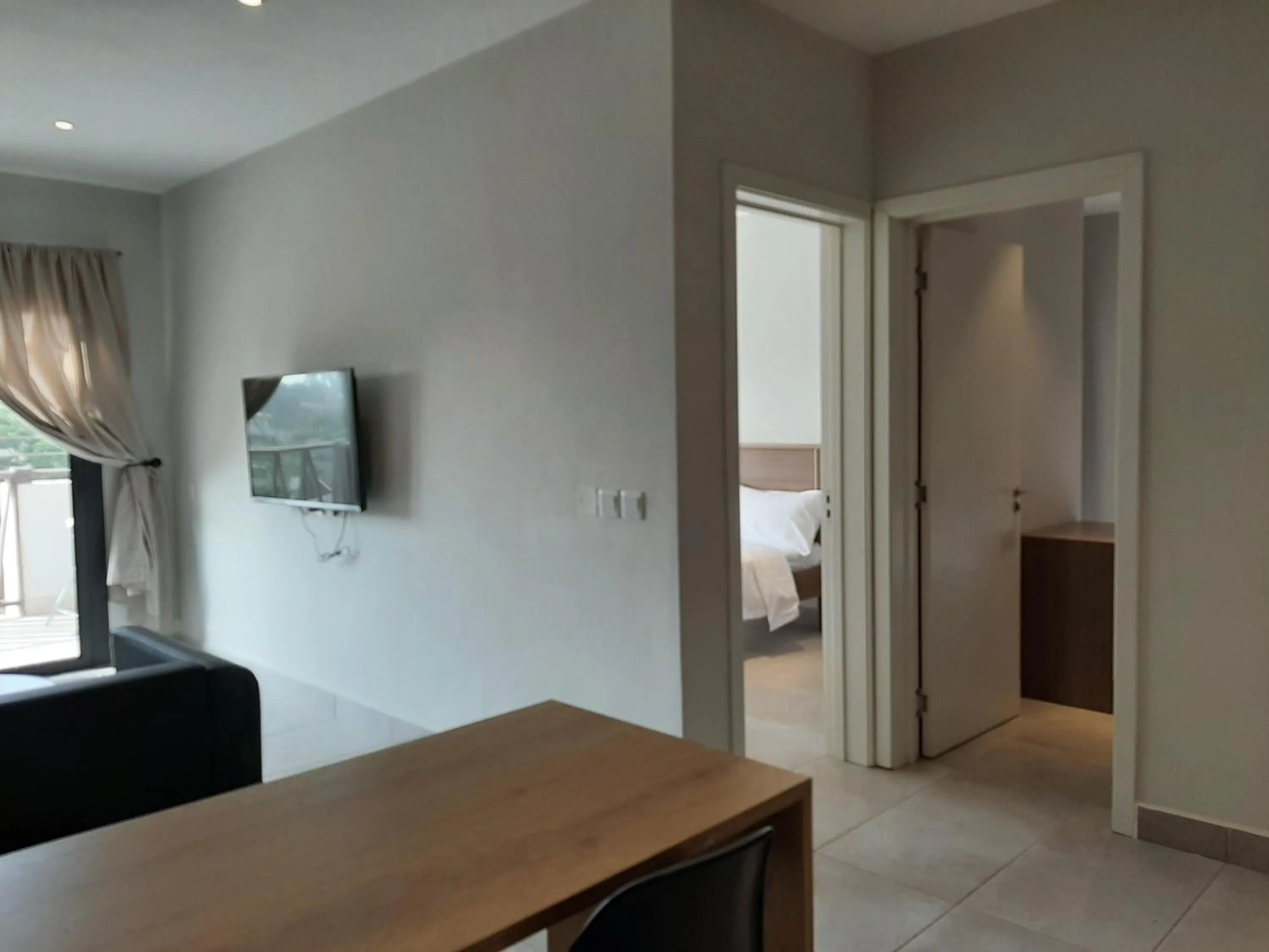 Living room, Bed in Forest View Apartments