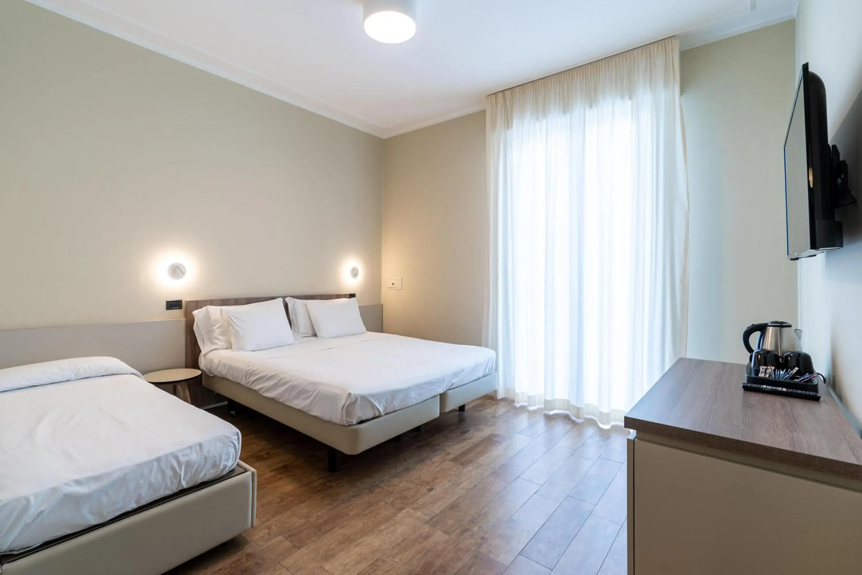 Superior Triple Room in Hotel Estense Superior Triple Room in Hotel Estense