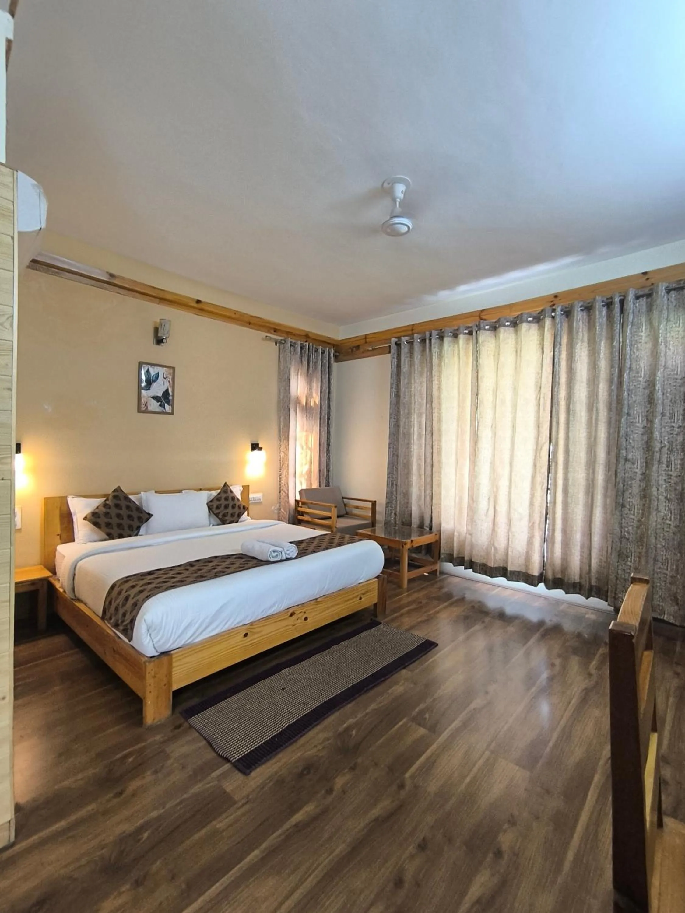 Bed in Tirthan Grand Riverside