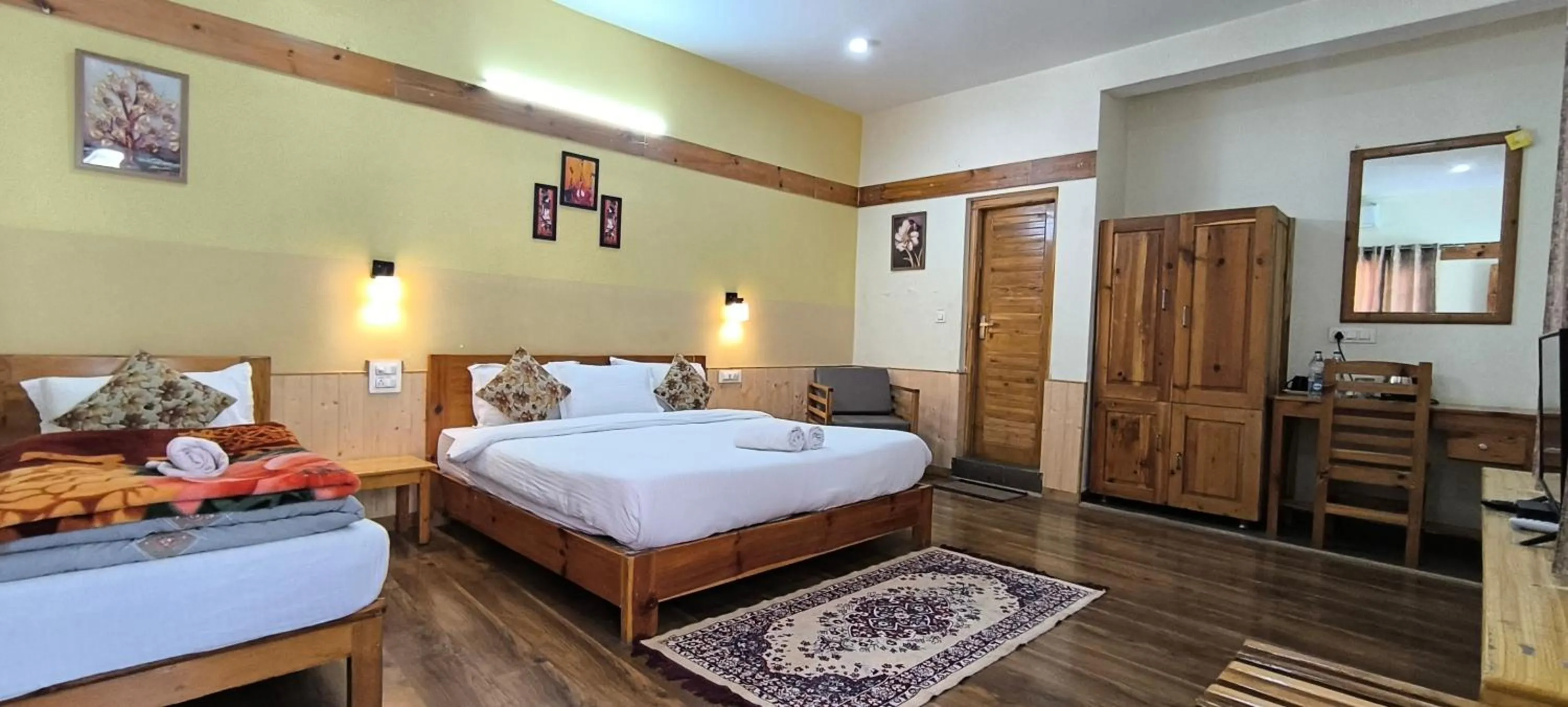 Bed in Tirthan Grand Riverside