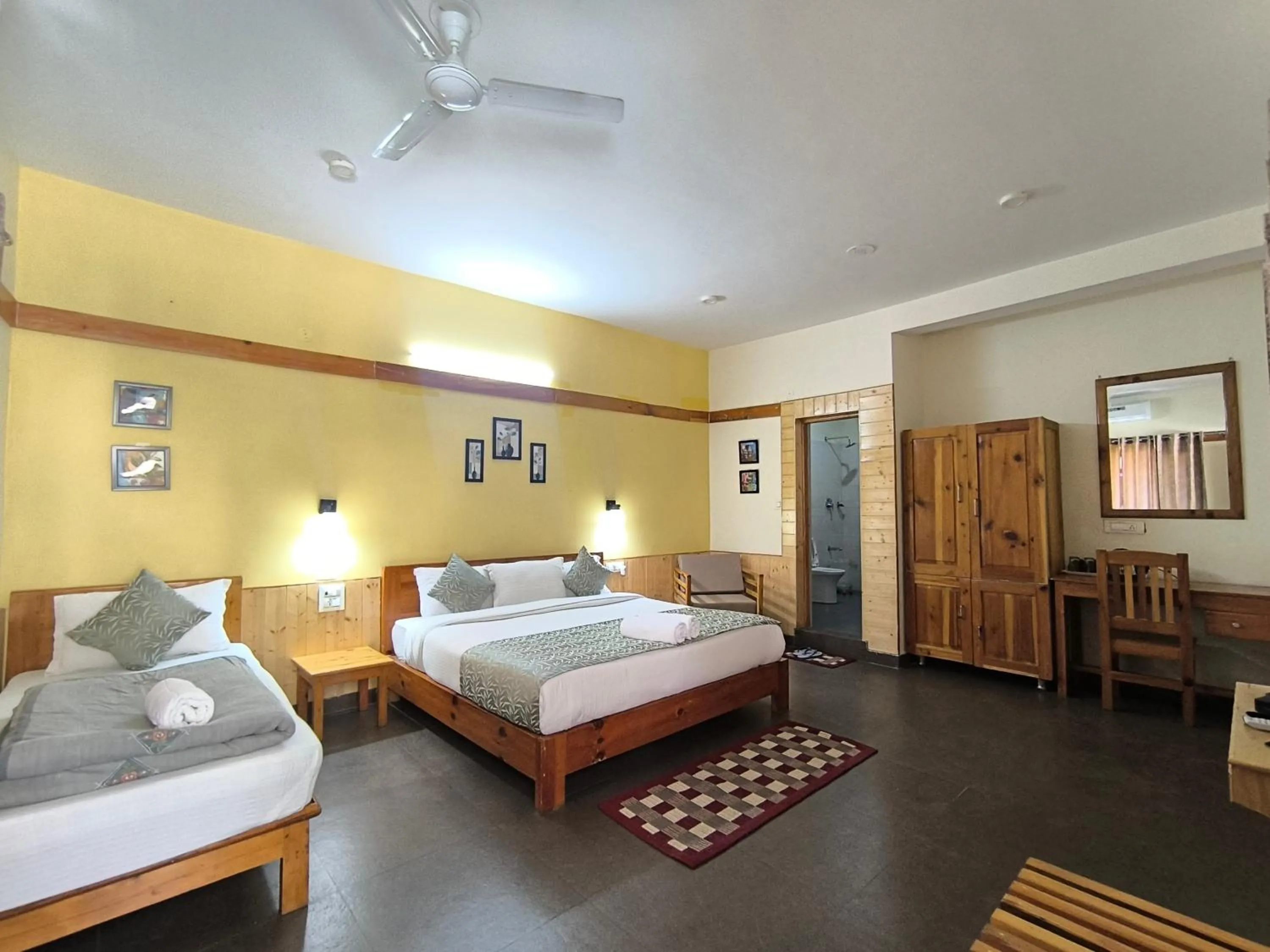 Bed in Tirthan Grand Riverside