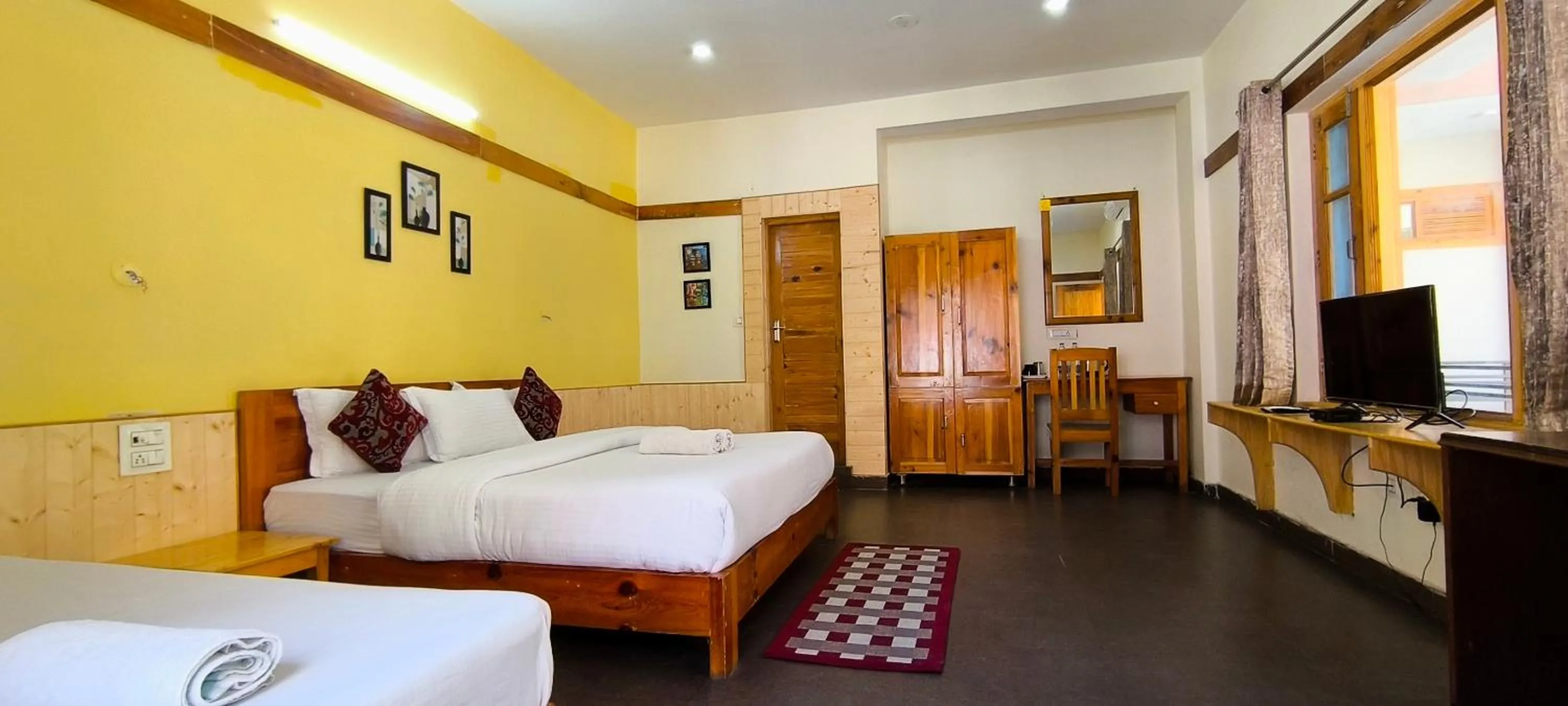 Bed in Tirthan Grand Riverside