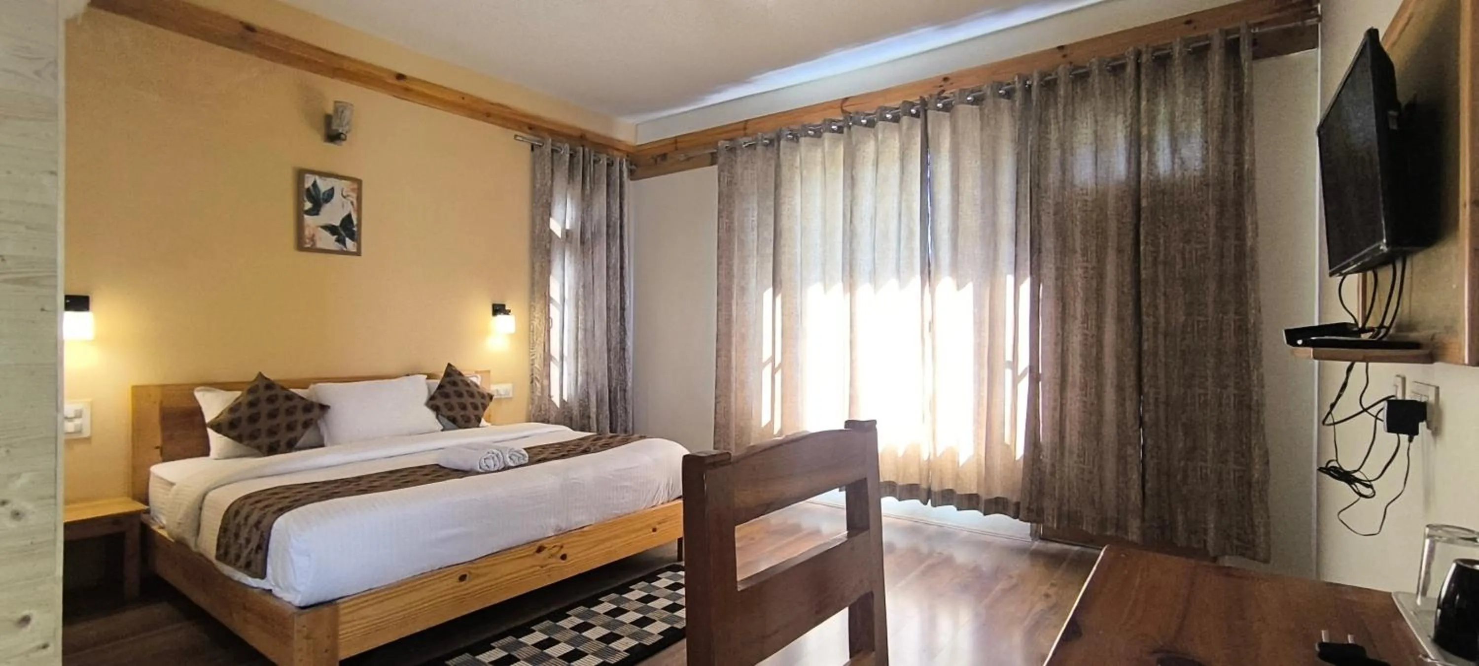 Bed in Tirthan Grand Riverside