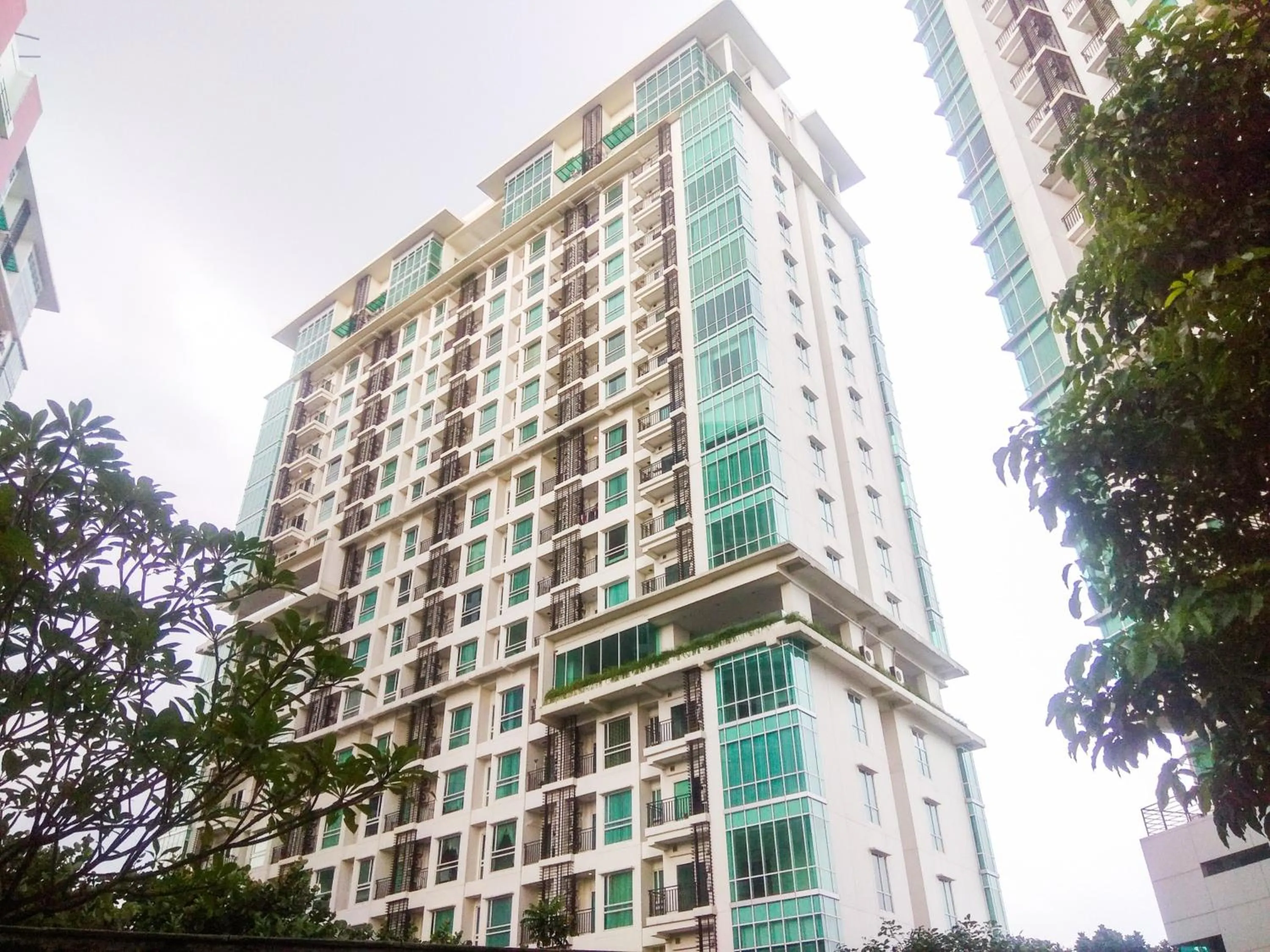 Property building in Good Location with Simply Furnished 1BR Apartment Woodland Park Residence By Travelio