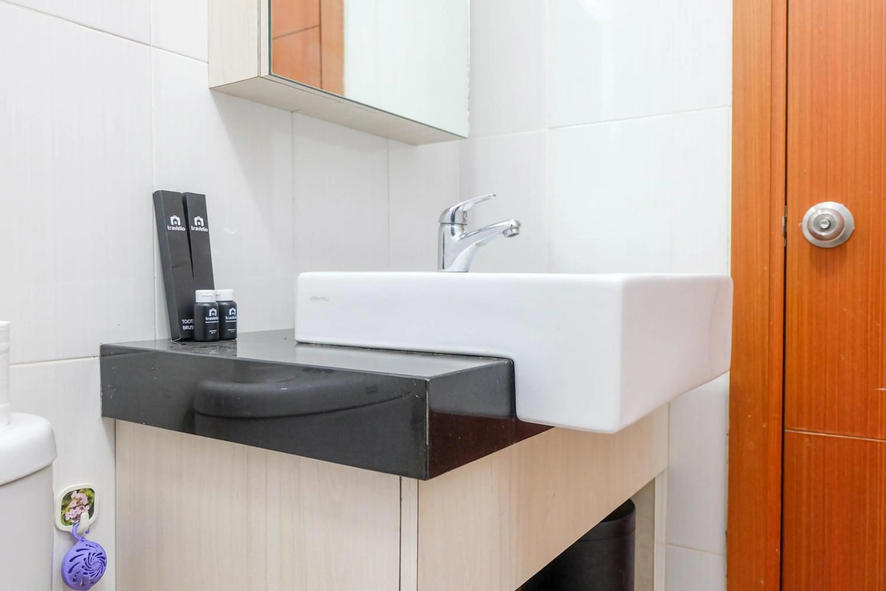 Bathroom in Good Location with Simply Furnished 1BR Apartment Woodland Park Residence By Travelio