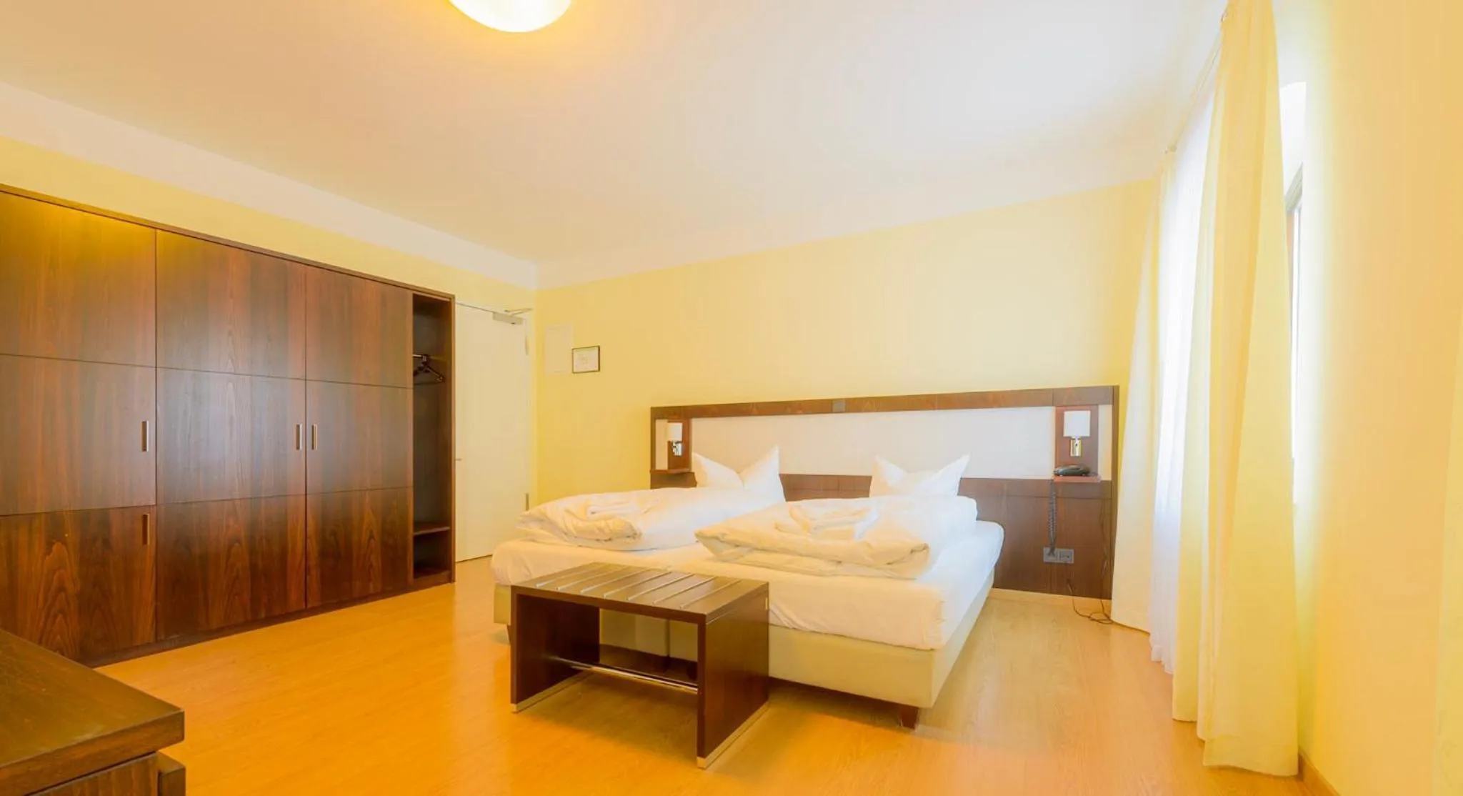 Photo of the whole room, Bed in Hotel Am Tiefwarensee