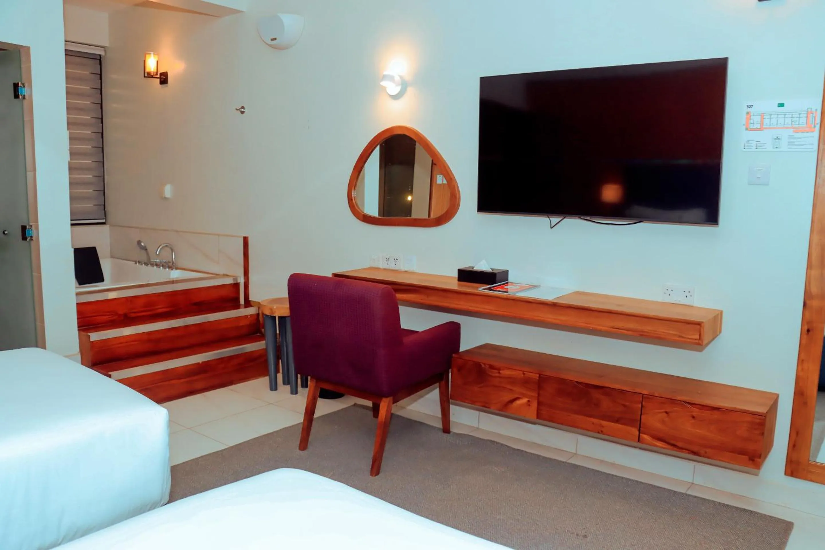 Communal lounge/ TV room, Bed in Best Western Jangwani Sea Breeze Resort