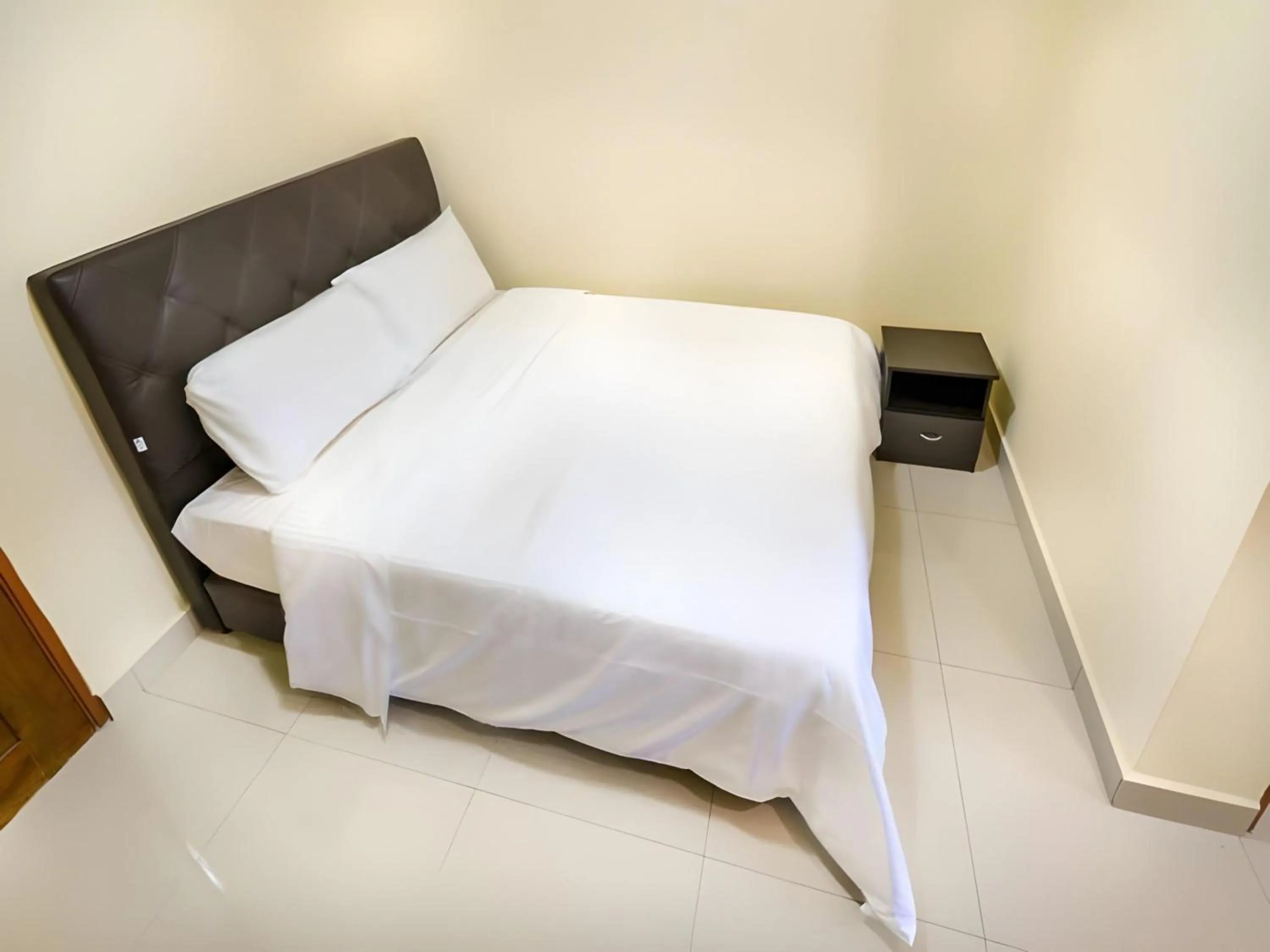 Photo of the whole room, Bed in Hotel O Bangi Sri Minang Guesthouse