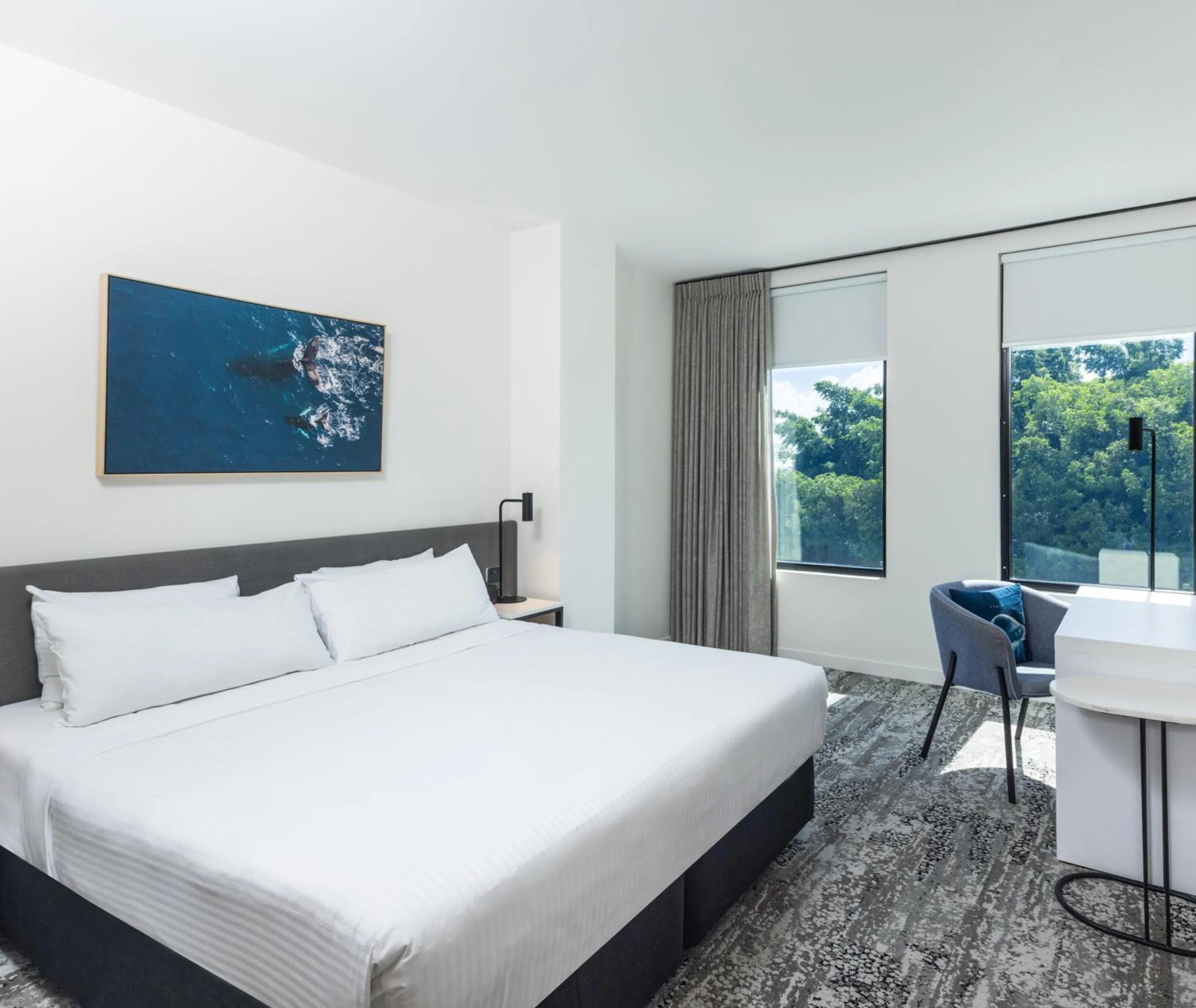 Bed in Oaks Cairns Hotel