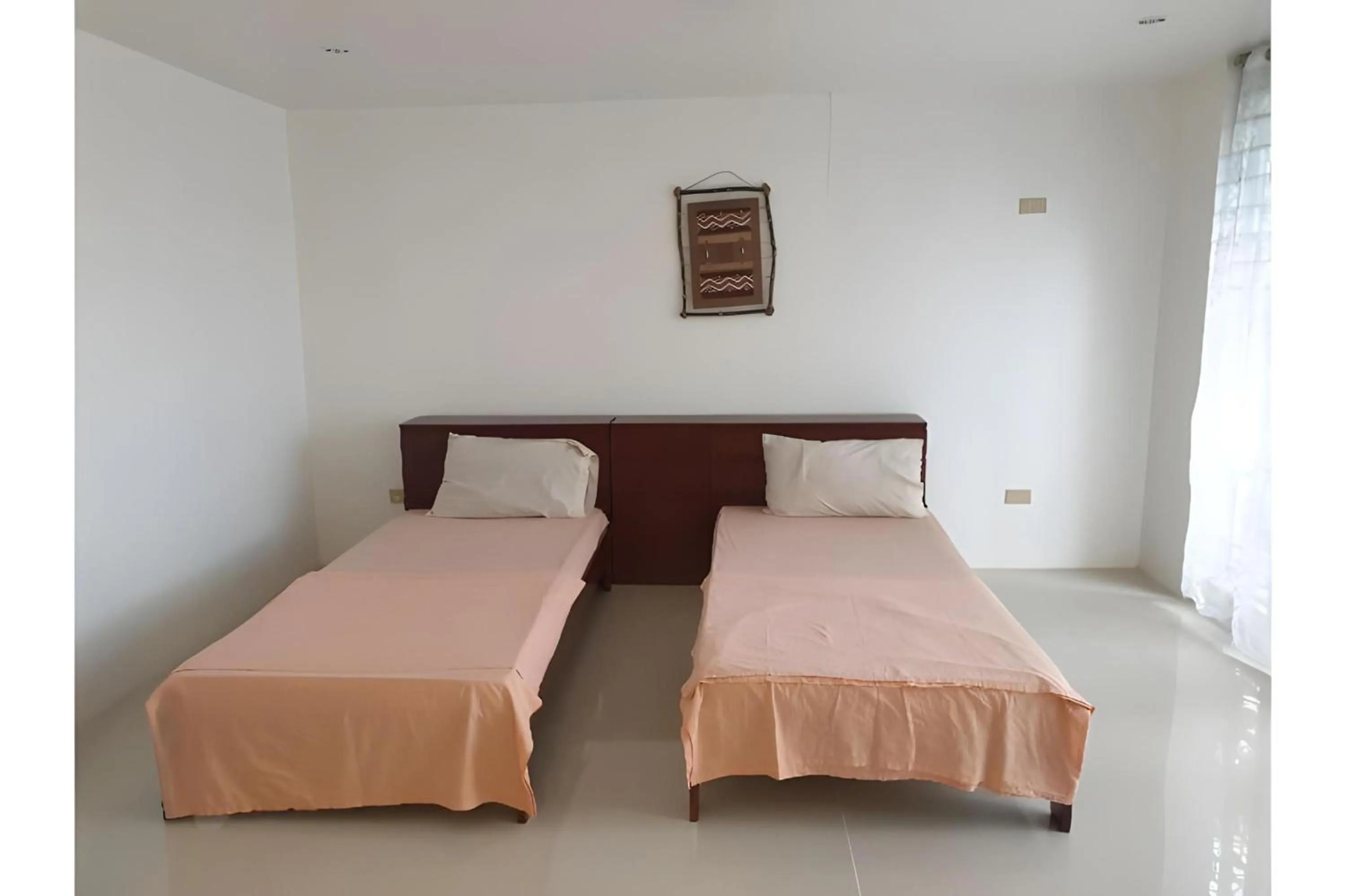 Photo of the whole room, Bed in OYO 588 Sunrock Resort