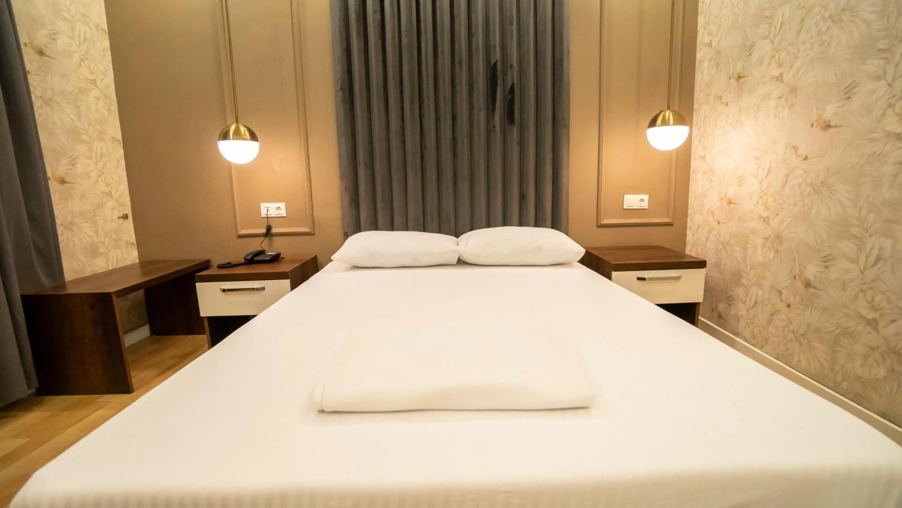 Bed in DYMAR HOTEL
