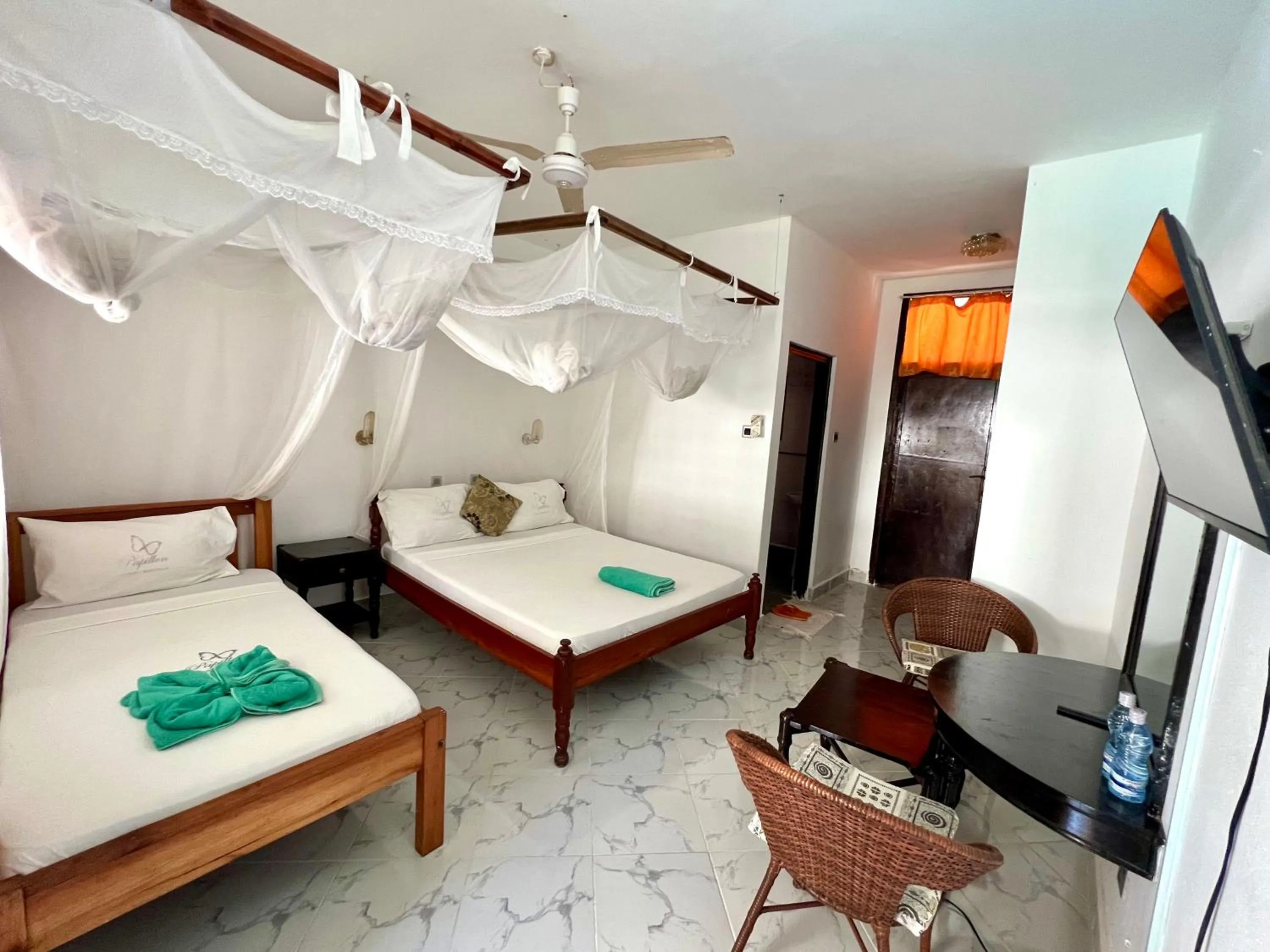 Bed in Papillon Garden Bar Villas