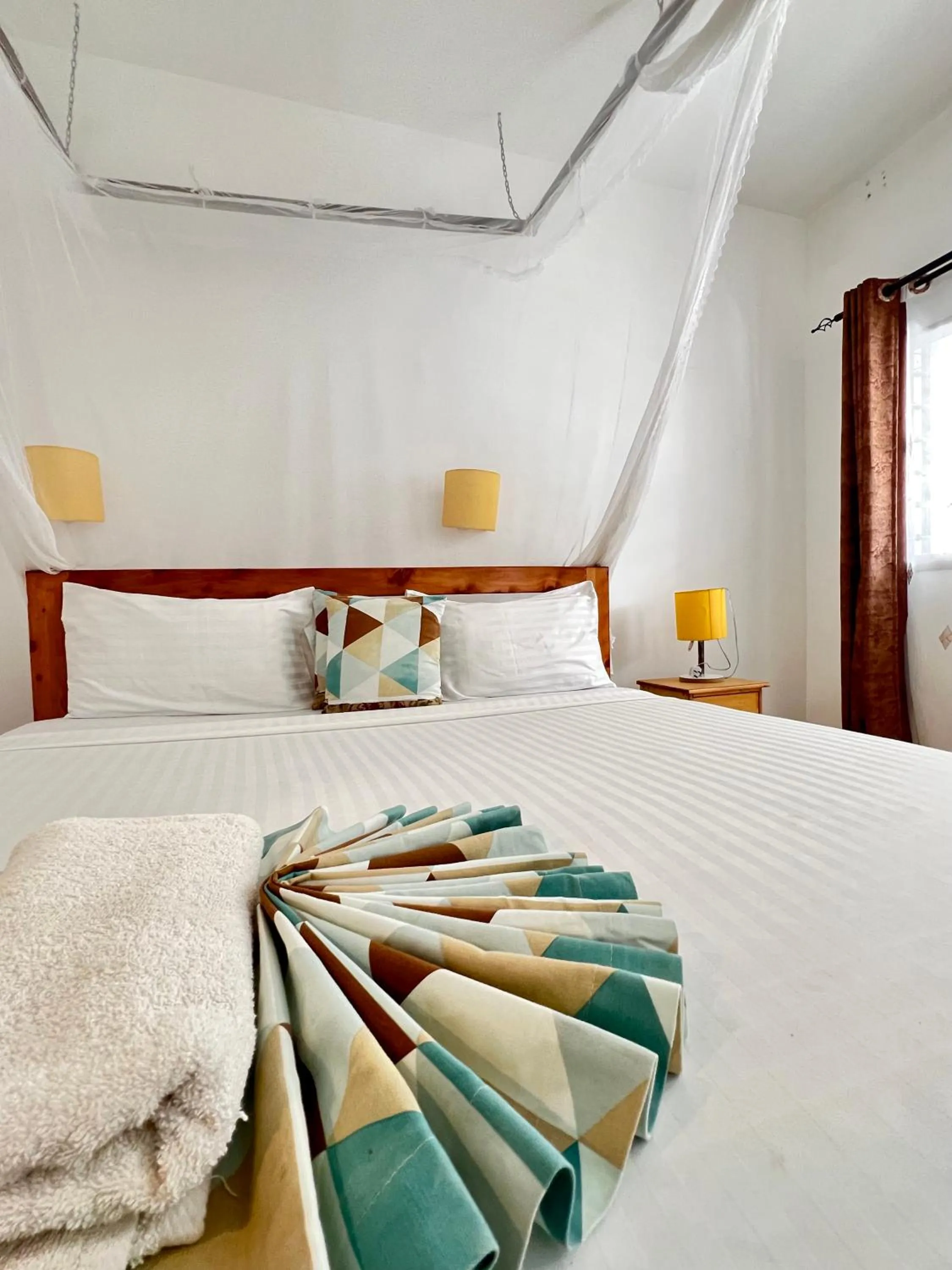 Bed in Papillon Garden Bar Villas