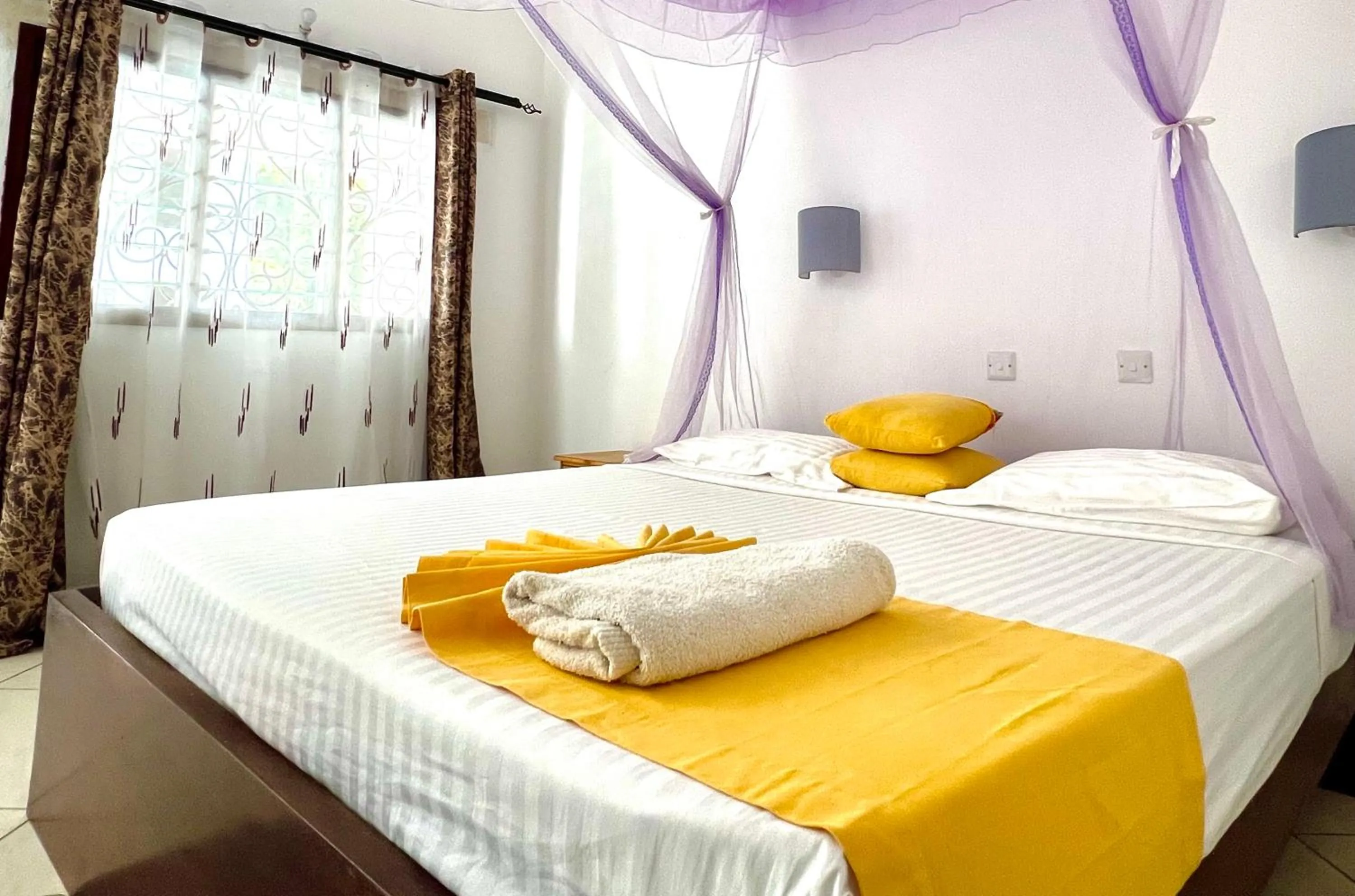 Bed in Papillon Garden Bar Villas