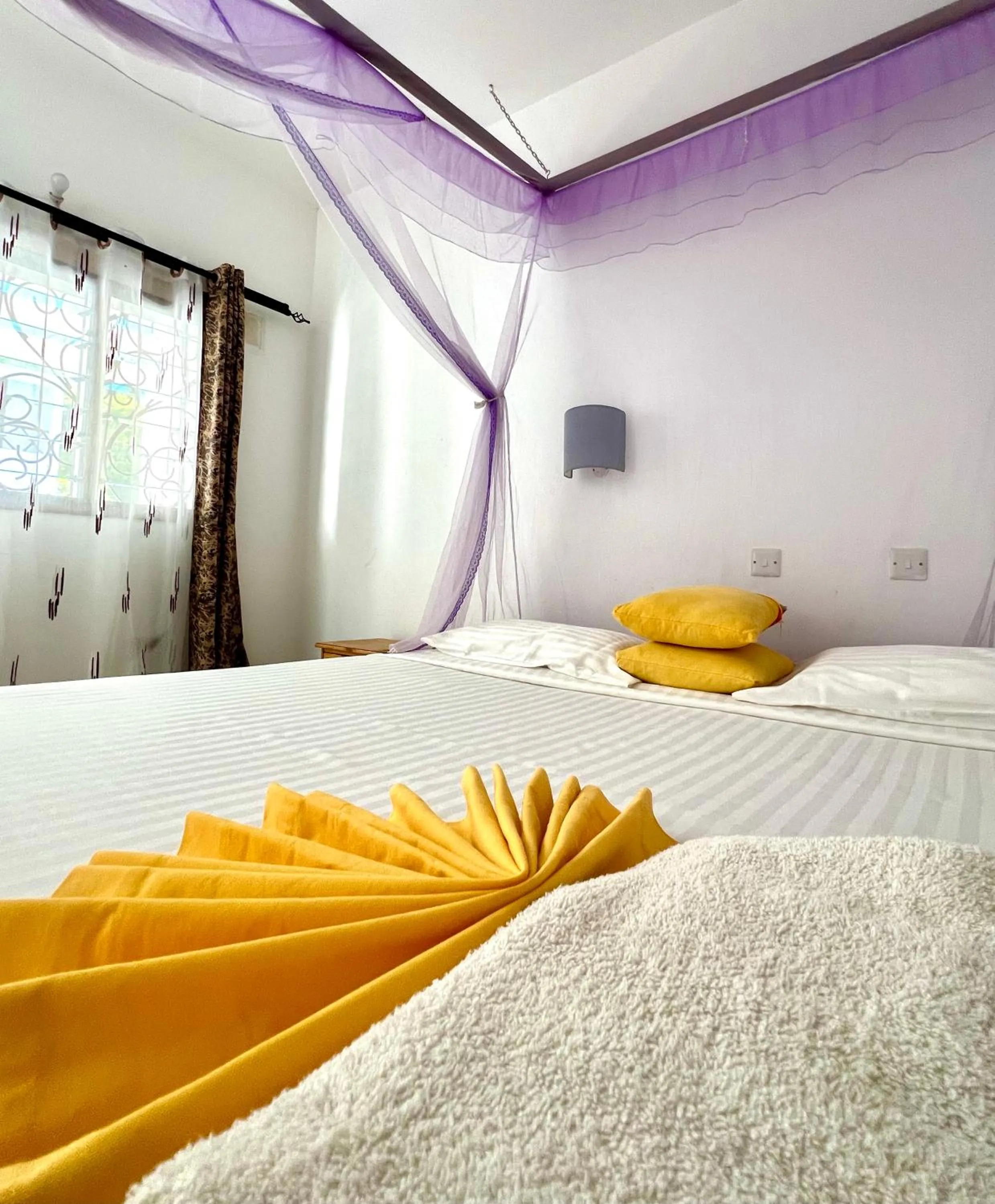Bed in Papillon Garden Bar Villas