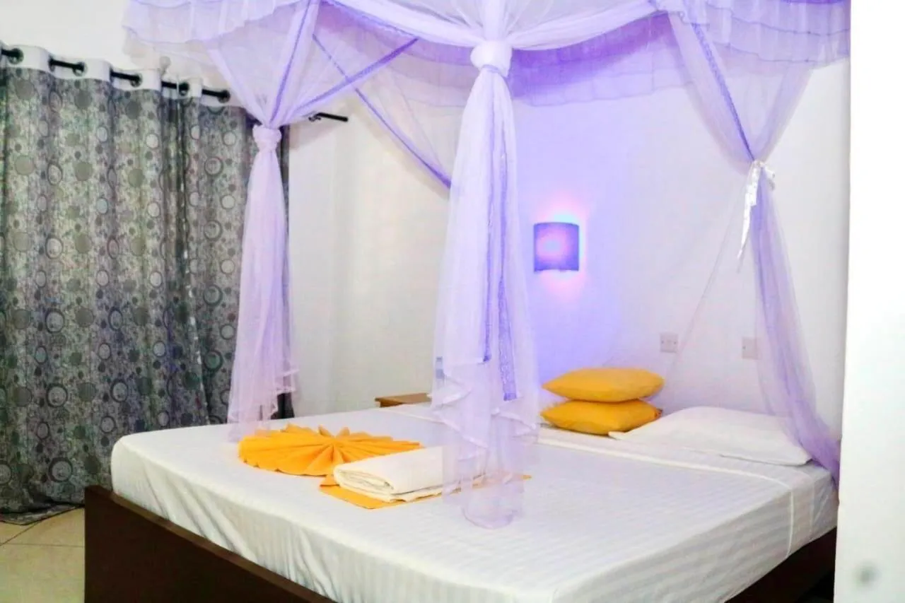Bed in Papillon Garden Bar Villas