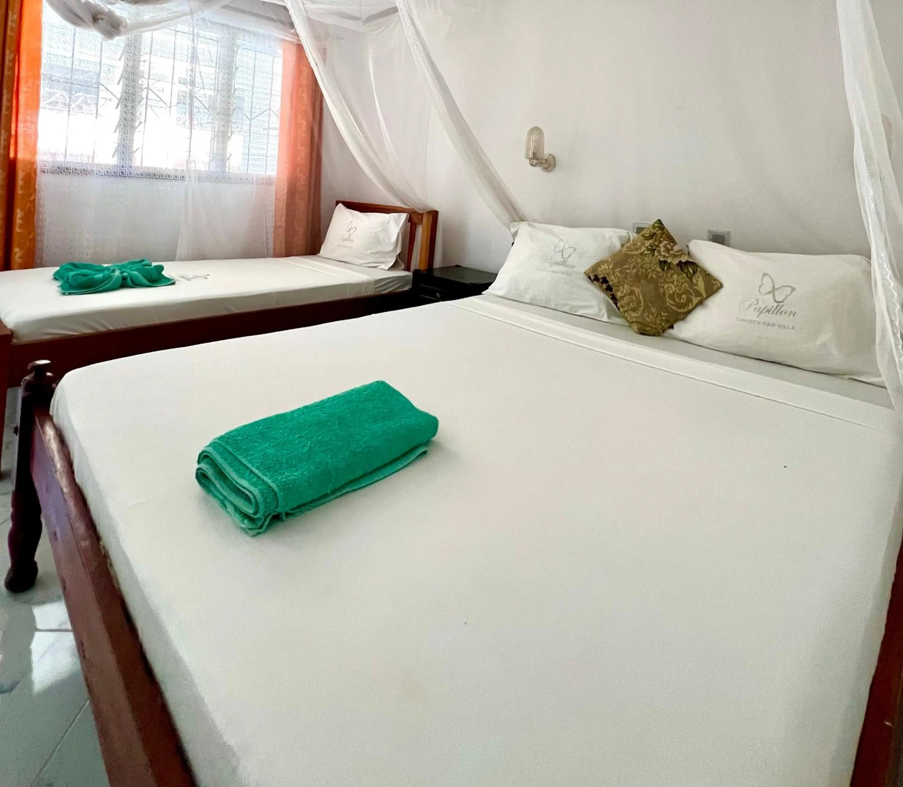 Bed in Papillon Garden Bar Villas