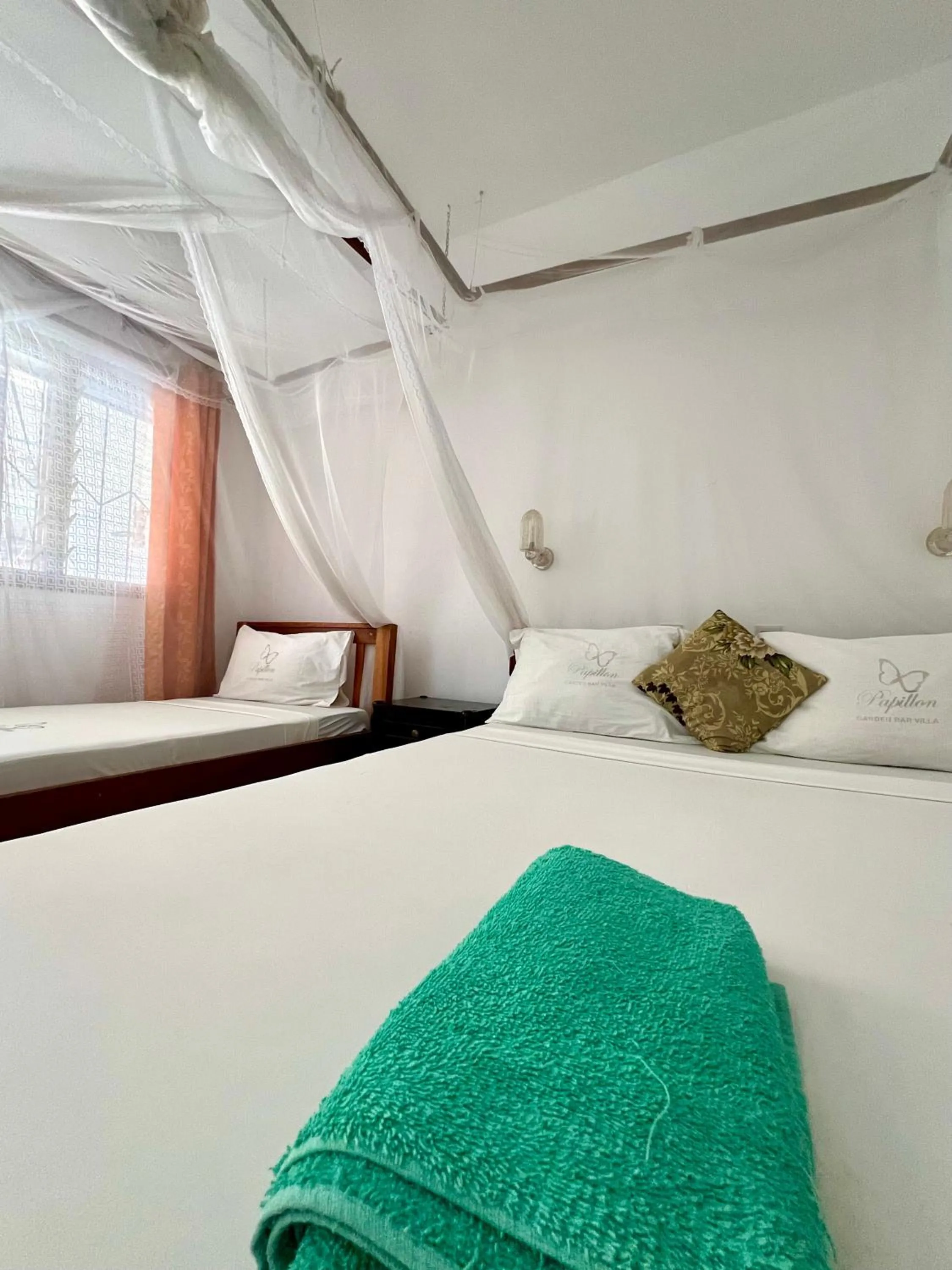Bed in Papillon Garden Bar Villas