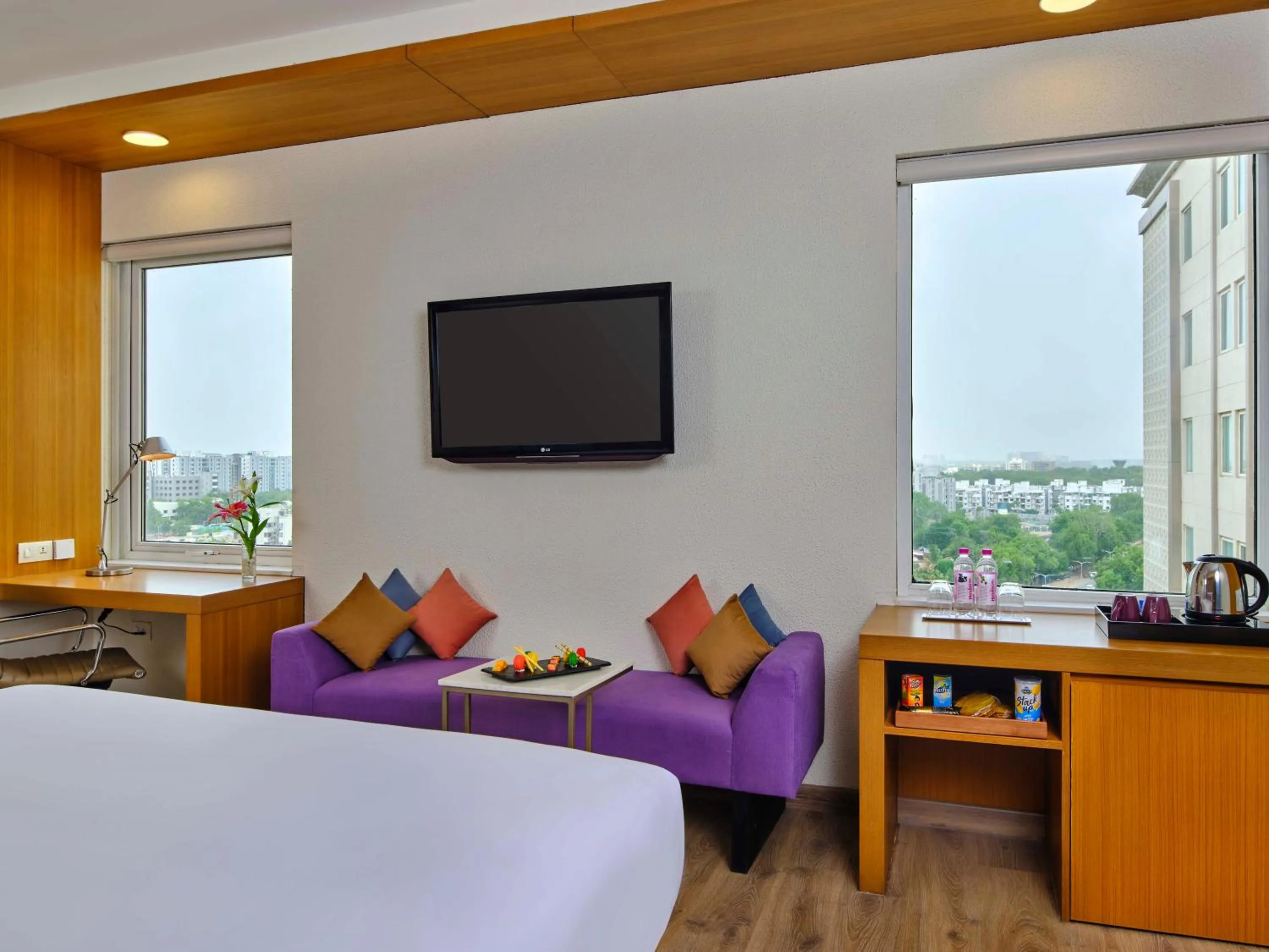 Seating area, Bed in Vivanta Ahmedabad SG Highway