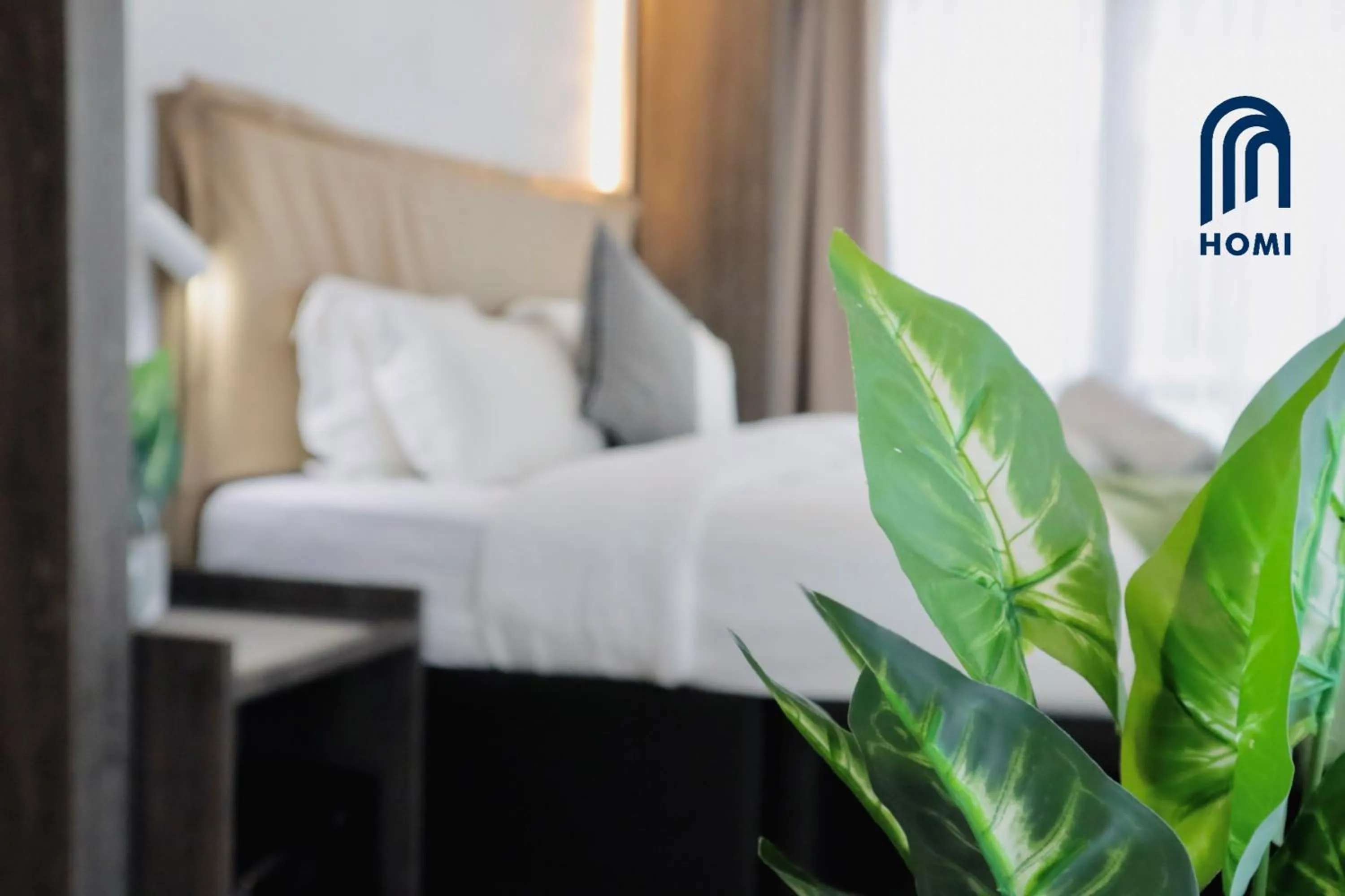 Photo of the whole room, Bed in Homi Oasis at KK Times Square 和逸绿洲