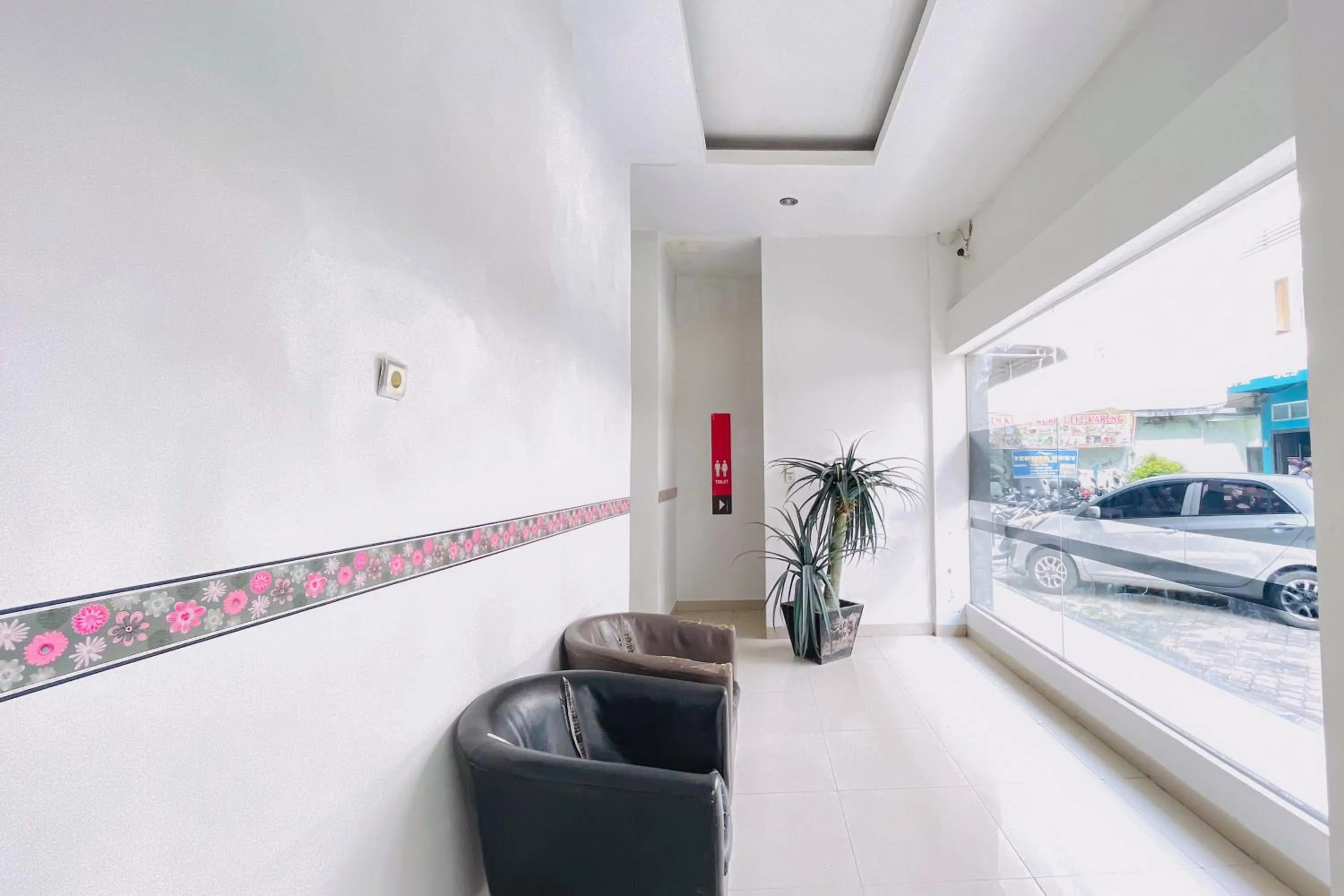 Seating area in RedDoorz at STM Suite Medan Amplas