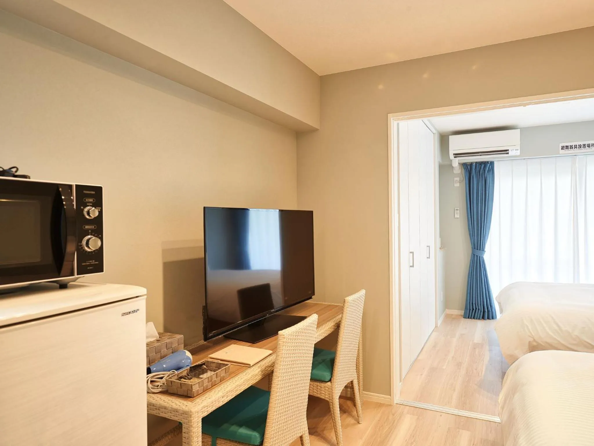 Photo of the whole room, TV/Entertainment Center in Tenpoint Hotel OKOU