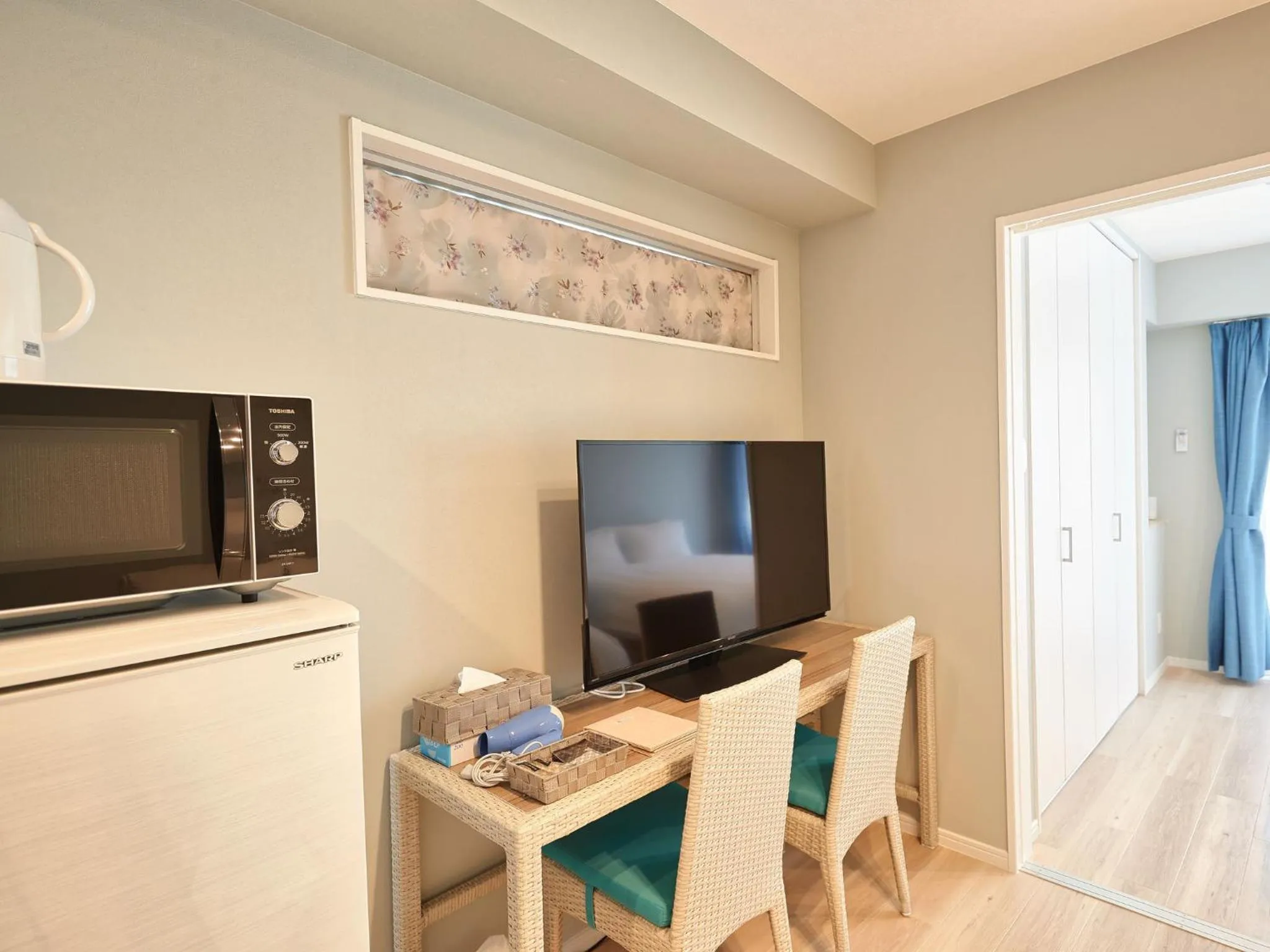 Photo of the whole room, TV/Entertainment Center in Tenpoint Hotel OKOU