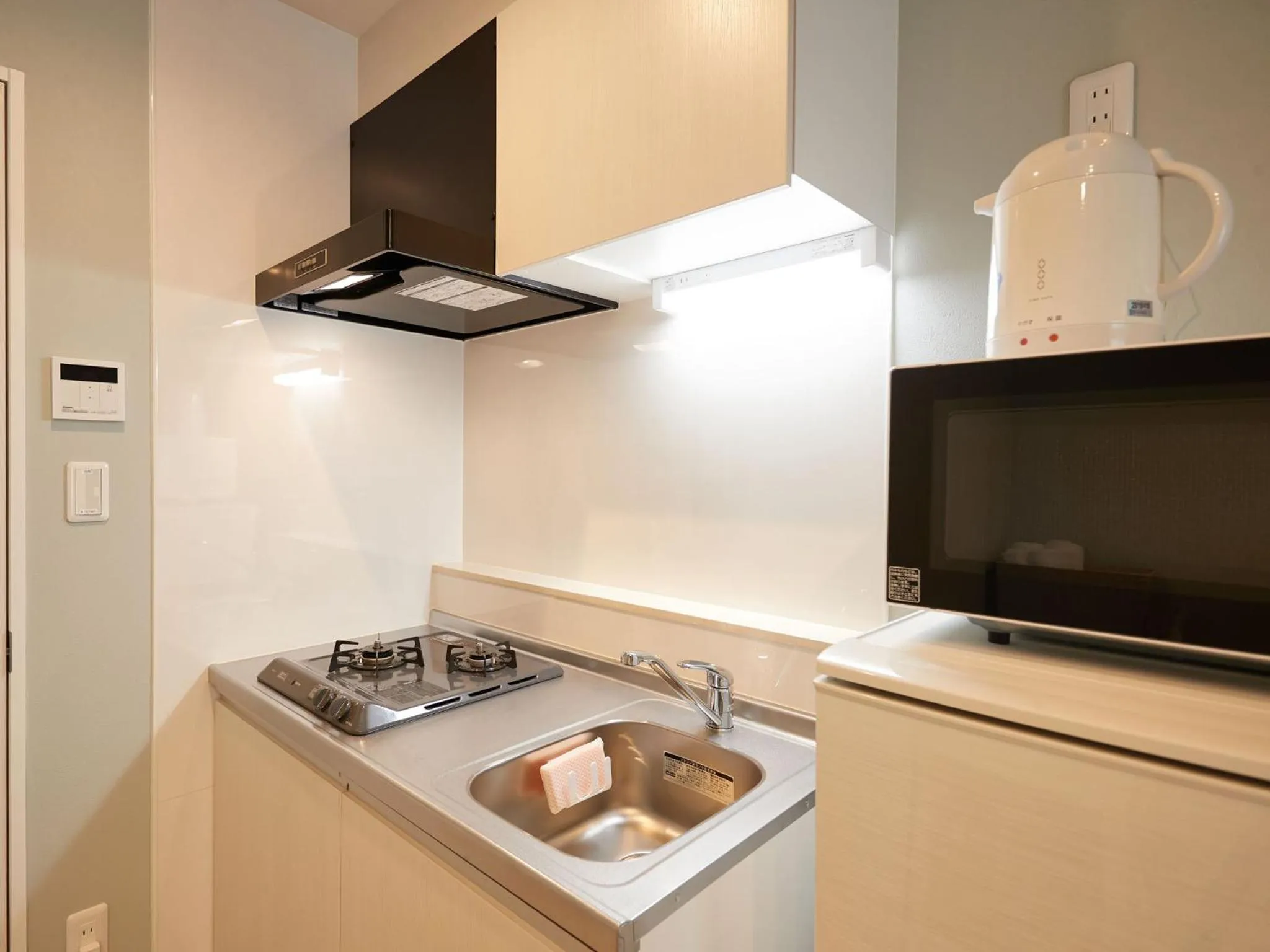 Kitchen or kitchenette in Tenpoint Hotel OKOU